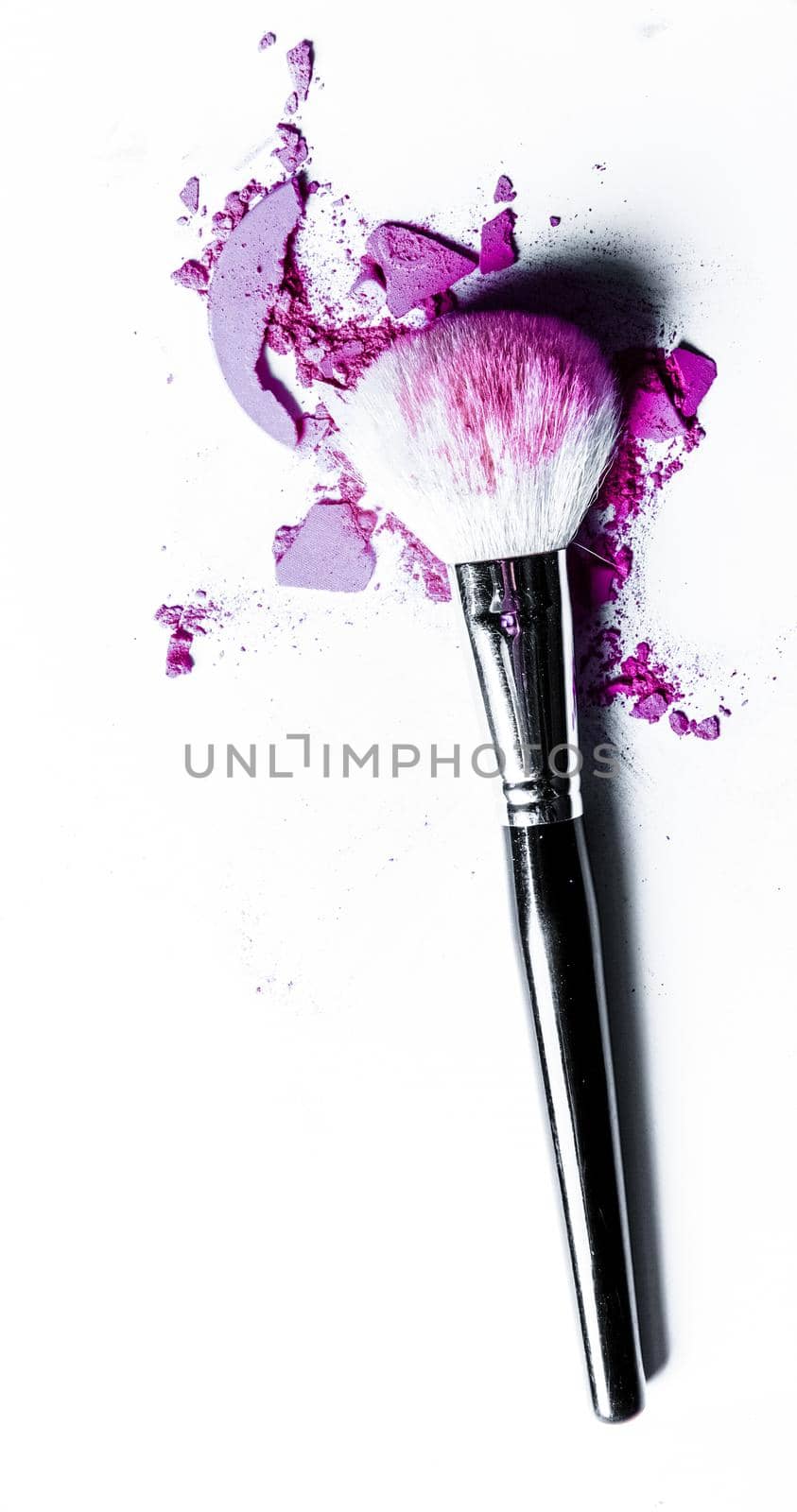 Beauty texture, cosmetic product and art of make-up concept - Brush with crushed eyeshadow and powder close-up isolated on white background