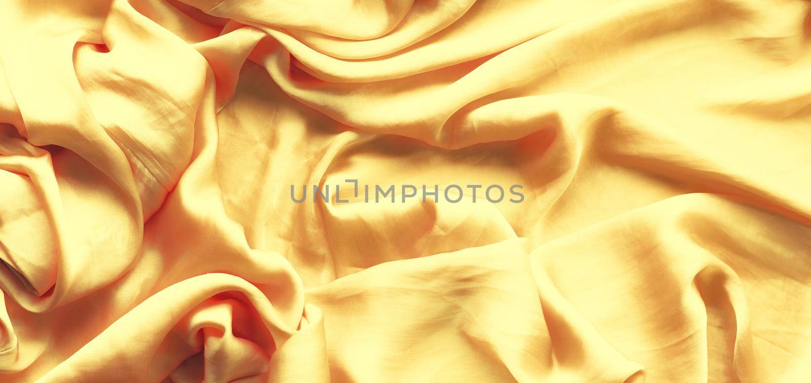 Luxury golden silk background texture - elegant fabric textures, abstract backgrounds and modern pastel colours concept