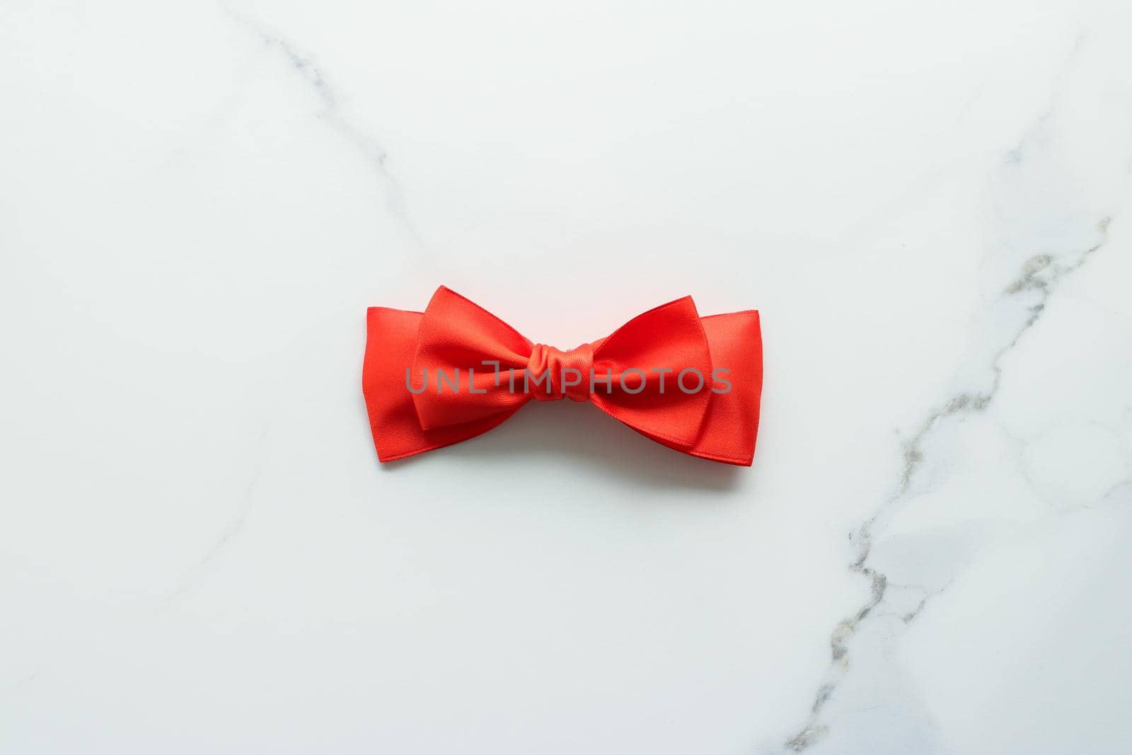 Holiday decor, feminine design and flatlay concept - Red silk ribbon on marble, top view