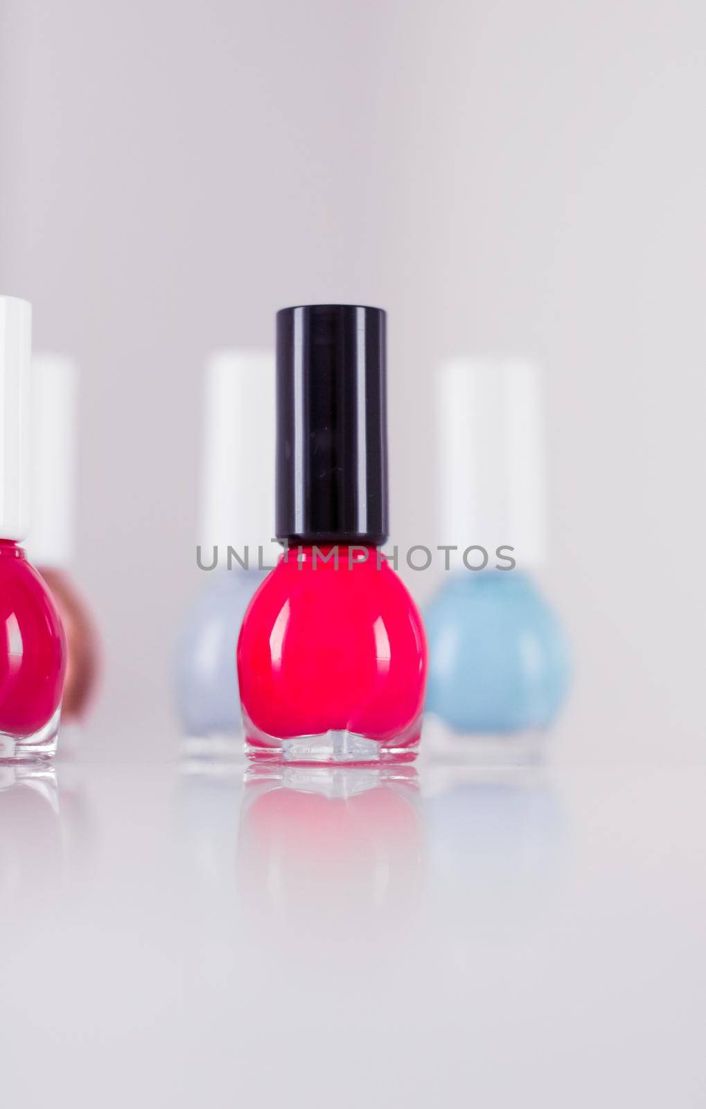 Beauty, make-up and cosmetics concept - Nail polish bottles, manicure and pedicure collection