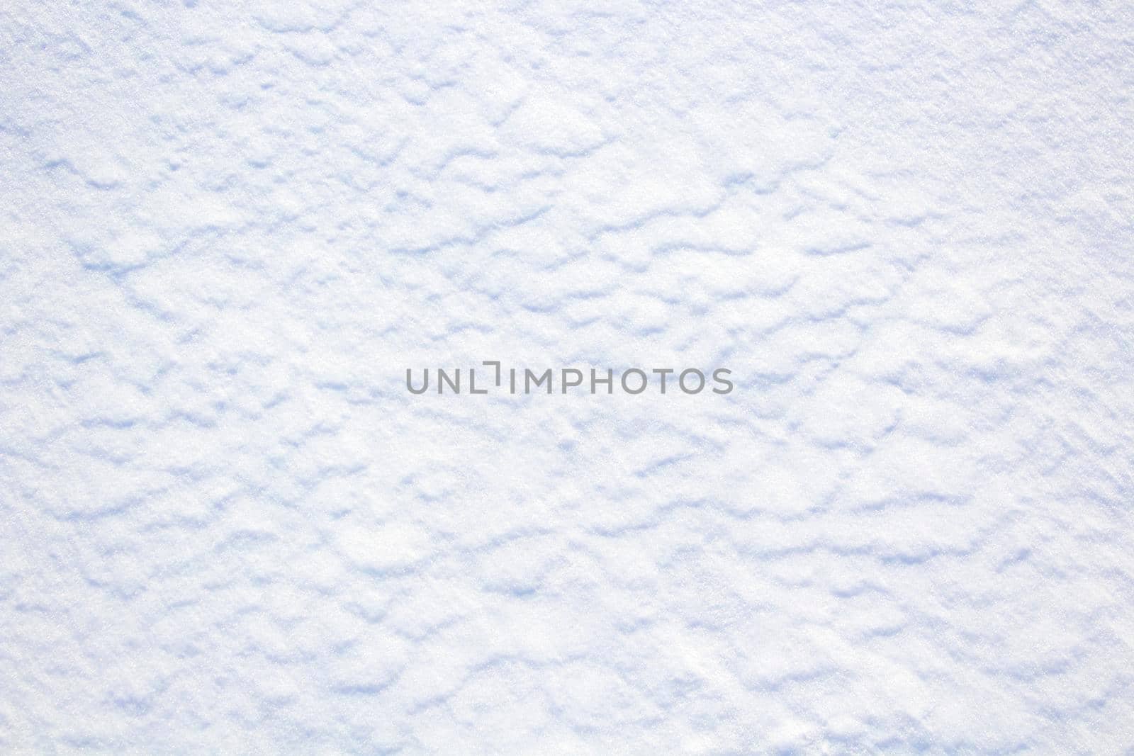 Snow Texture with beautiful relief, Nature Snow Surface in sunny day