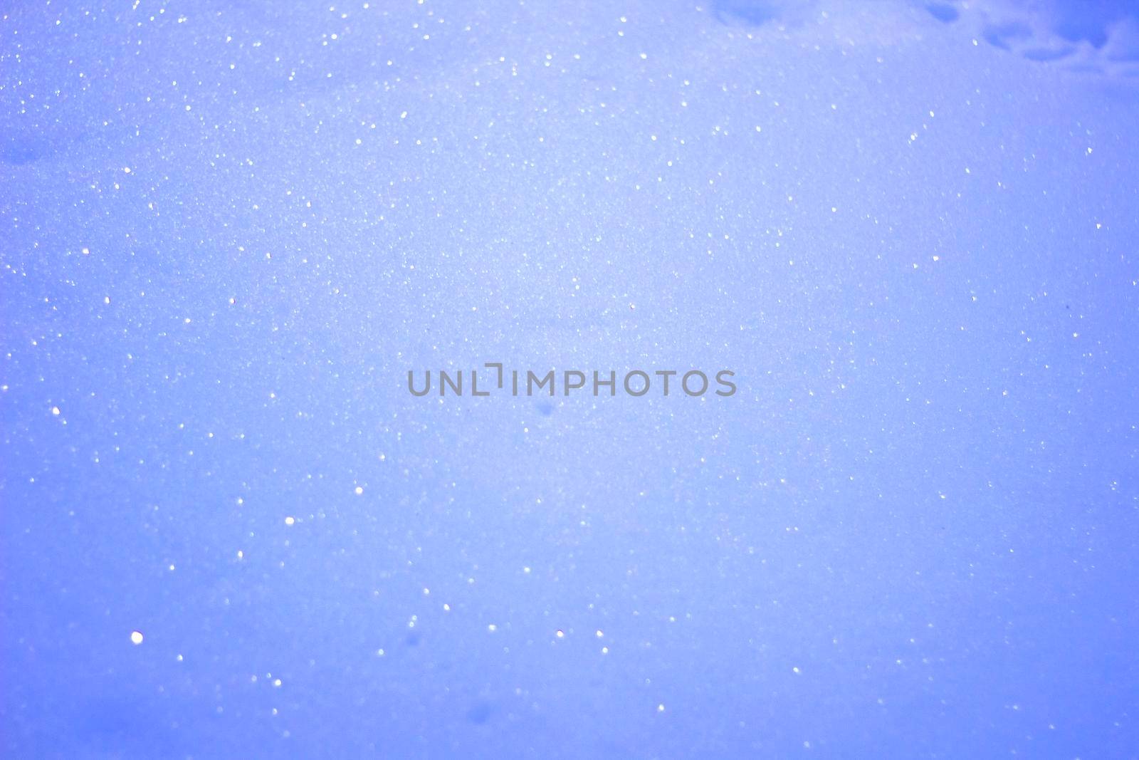 Sparkling Snow, Bright Blue Winter Christmas Pattern with Bokeh and stars.