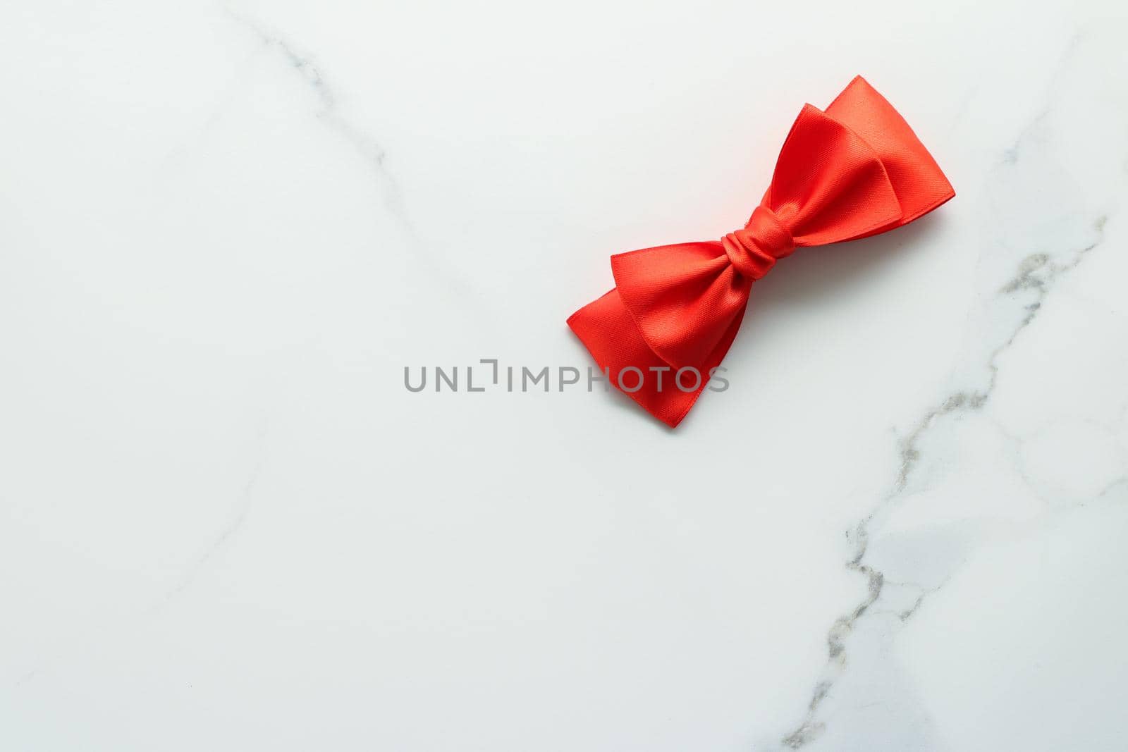 Holiday decor, feminine design and flatlay concept - Red silk ribbon on marble, top view