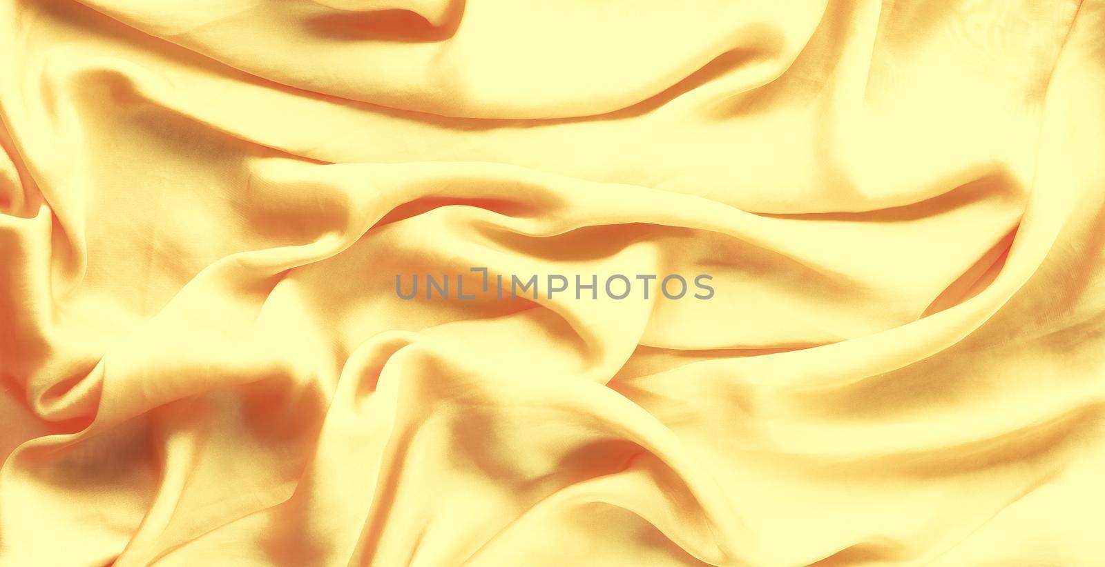 Luxury golden silk background texture - elegant fabric textures, abstract backgrounds and modern pastel colours concept