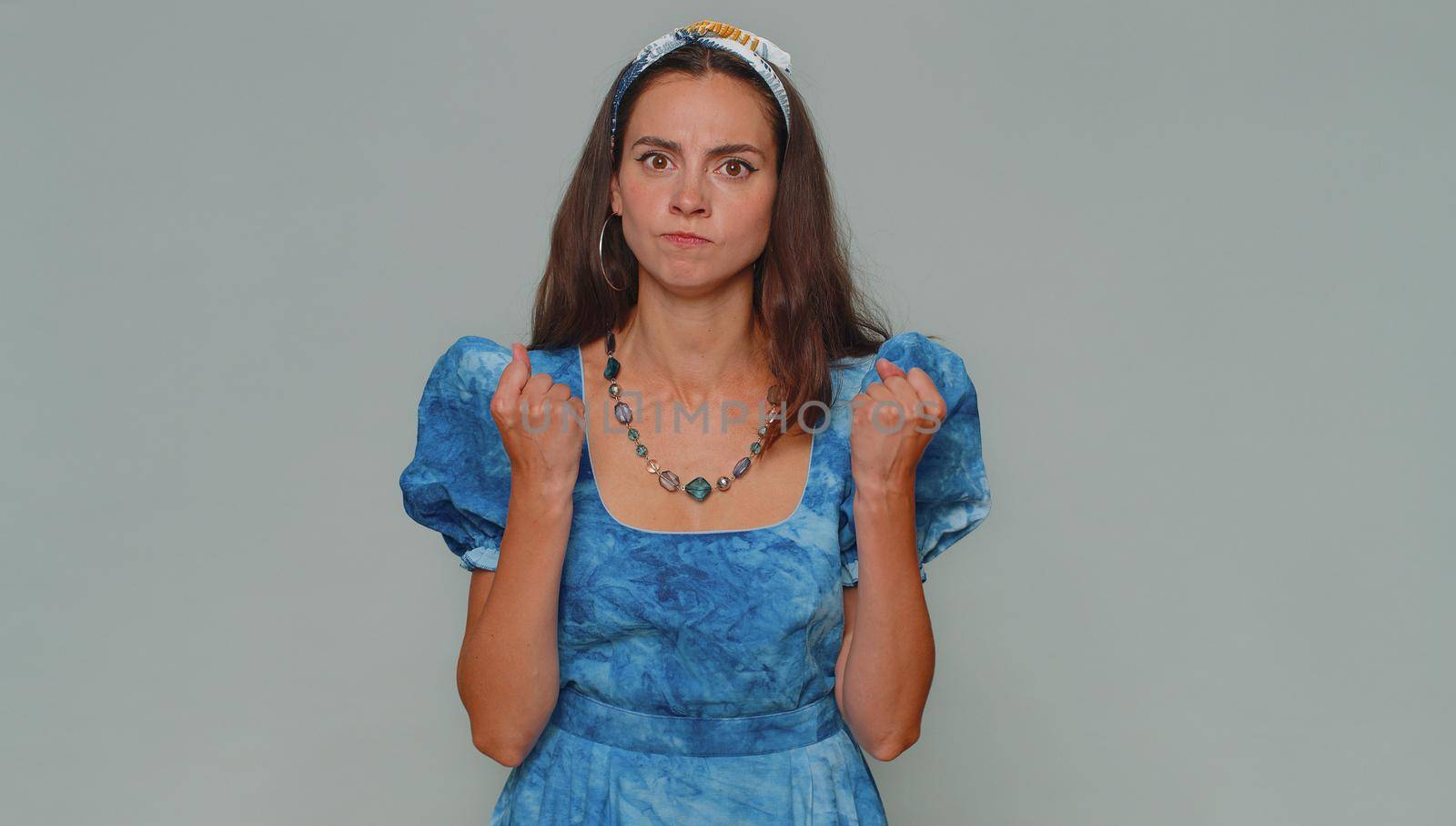 Dissatisfied pretty young woman asking reason of failure, expressing disbelief irritation, feeling bored, disappointed in result, bad news. Adult stylish girl isolated alone on gray studio background