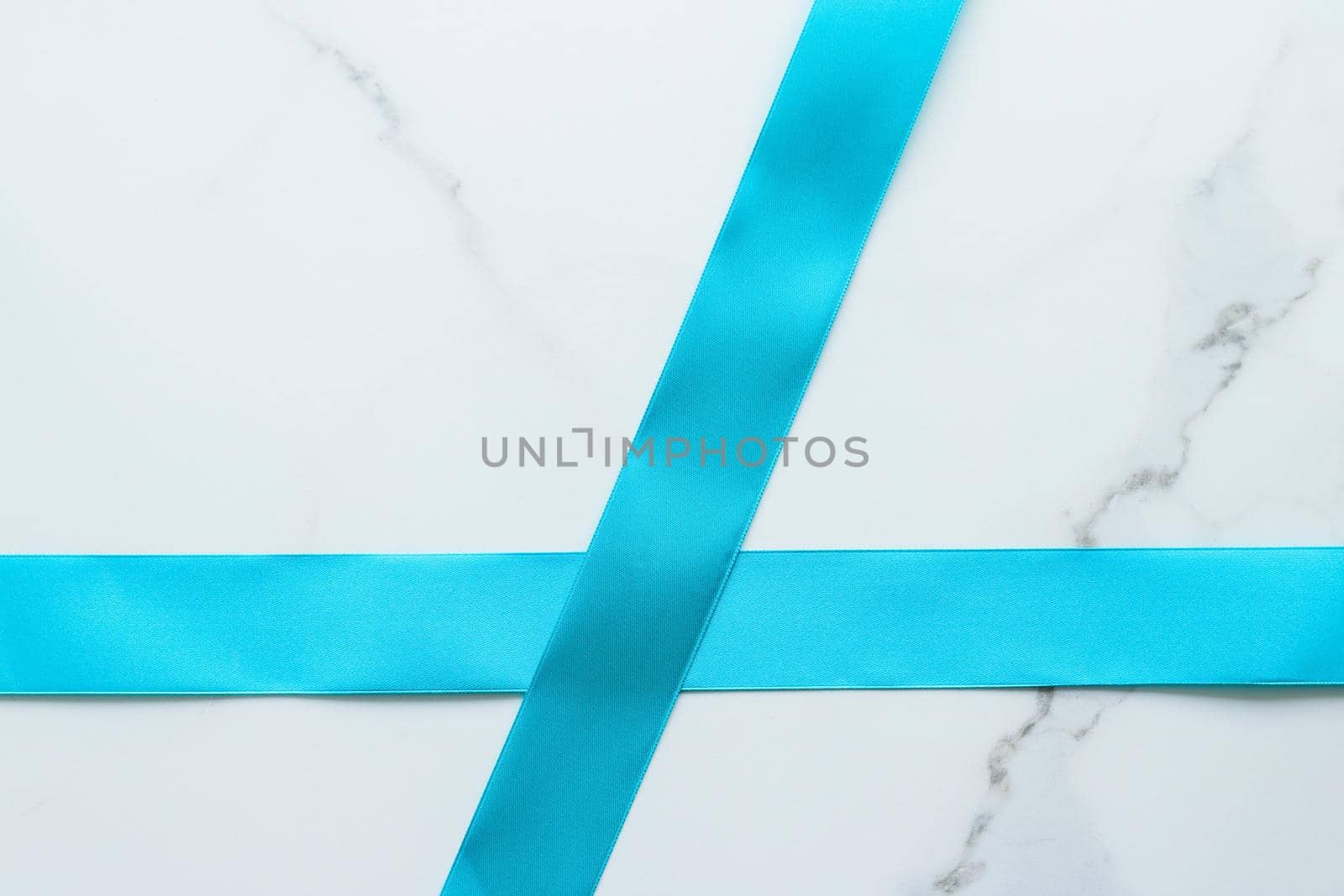 Holiday decor, feminine design and flatlay concept - Blue silk ribbon on marble, top view