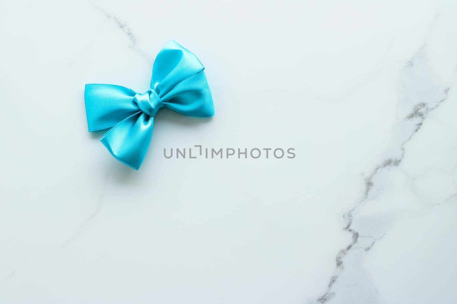 Holiday decor, feminine design and flatlay concept - Blue silk ribbon on marble, top view