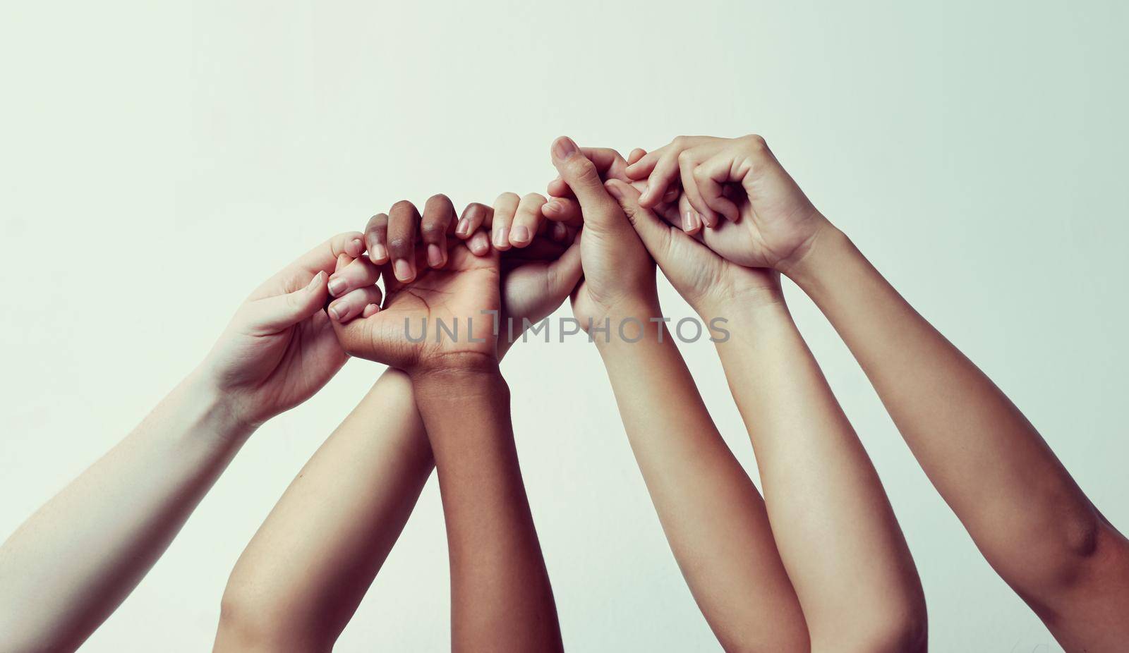 True support. a group of people holding each others thumbs with their hands raised