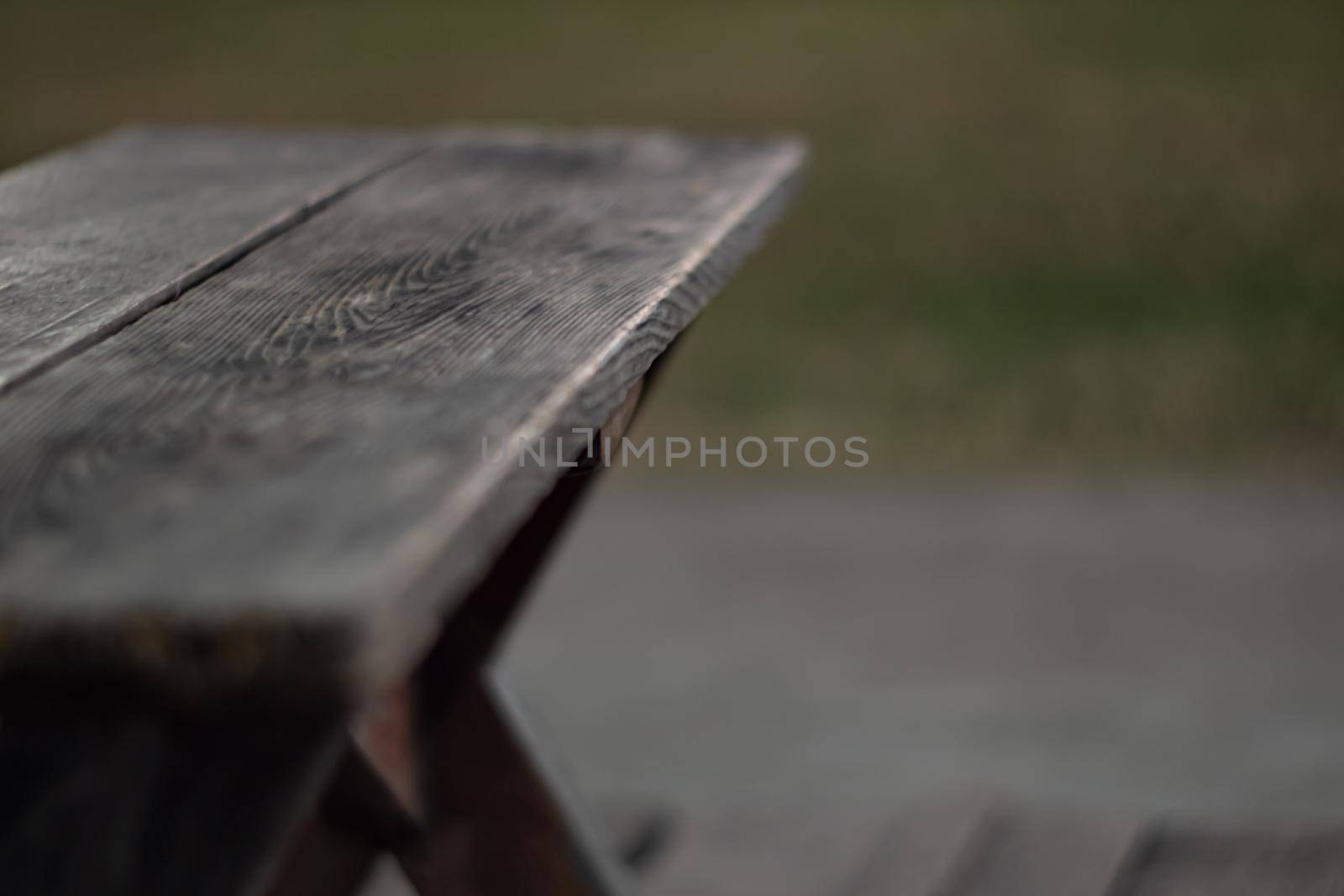 The shabby patio wooden furniture in the garden