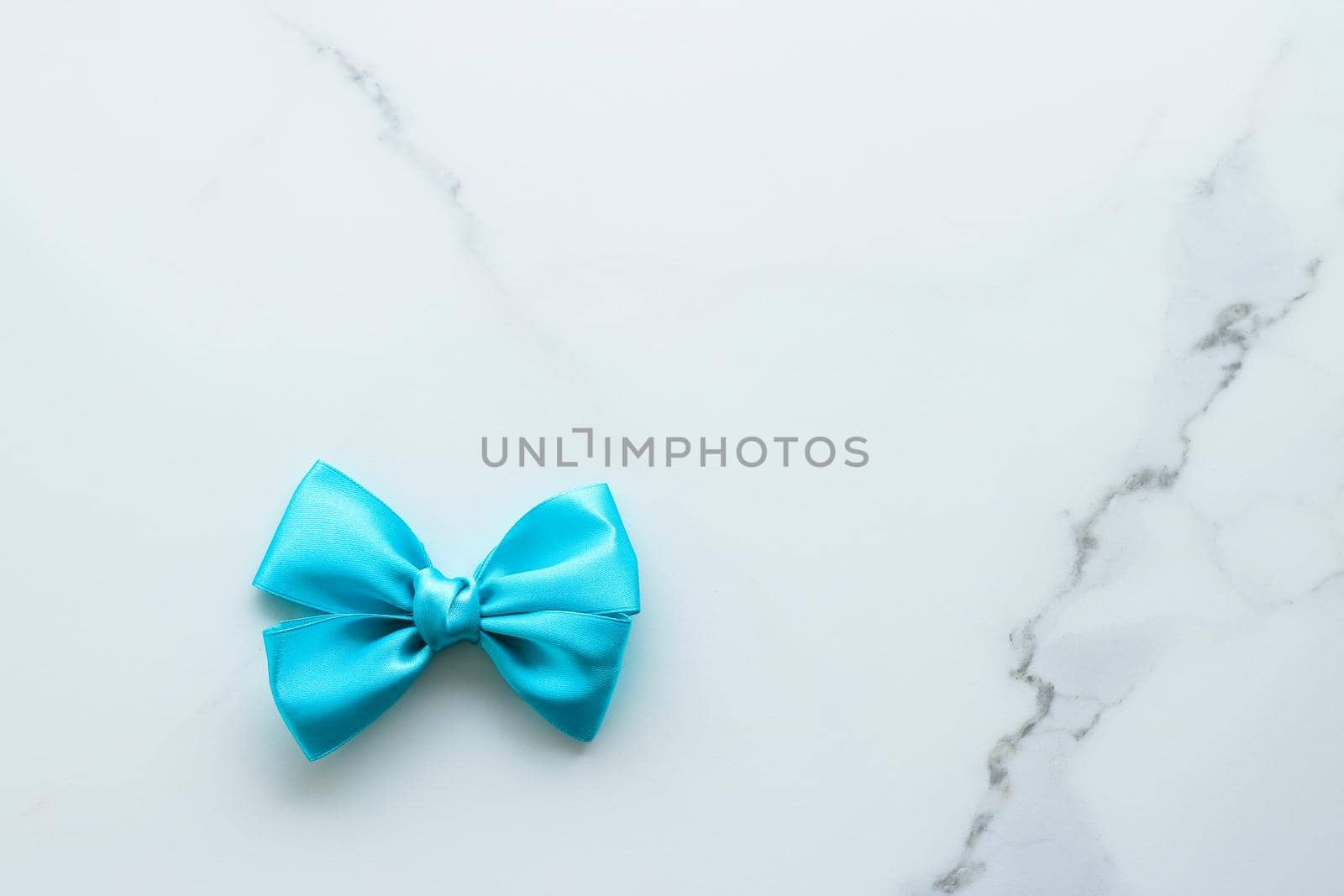 Holiday decor, feminine design and flatlay concept - Blue silk ribbon on marble, top view