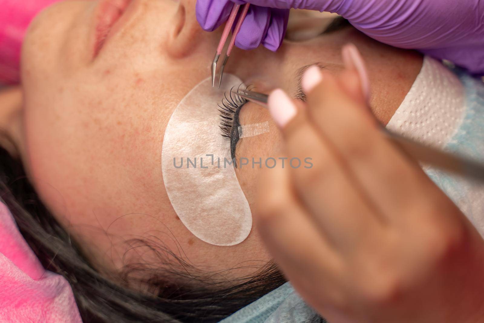 Eyelash extension procedure. Woman eye with long eyelashes. lashes, close up, macro, selective focus