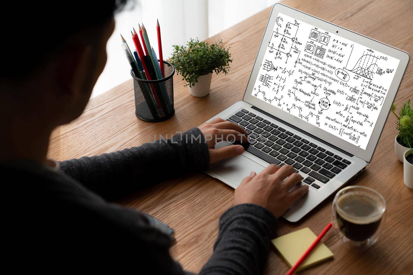 Mathematic equations and modish formula on computer screen showing concept of science and education