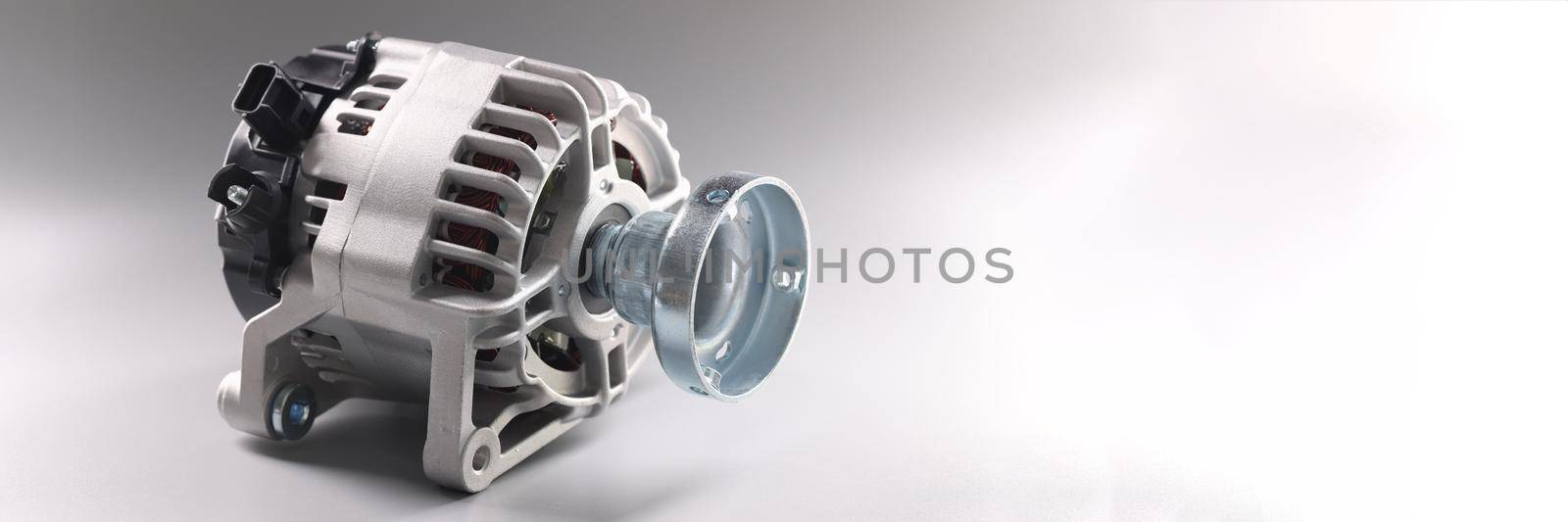 Closeup of car parts of generator on gray background by kuprevich