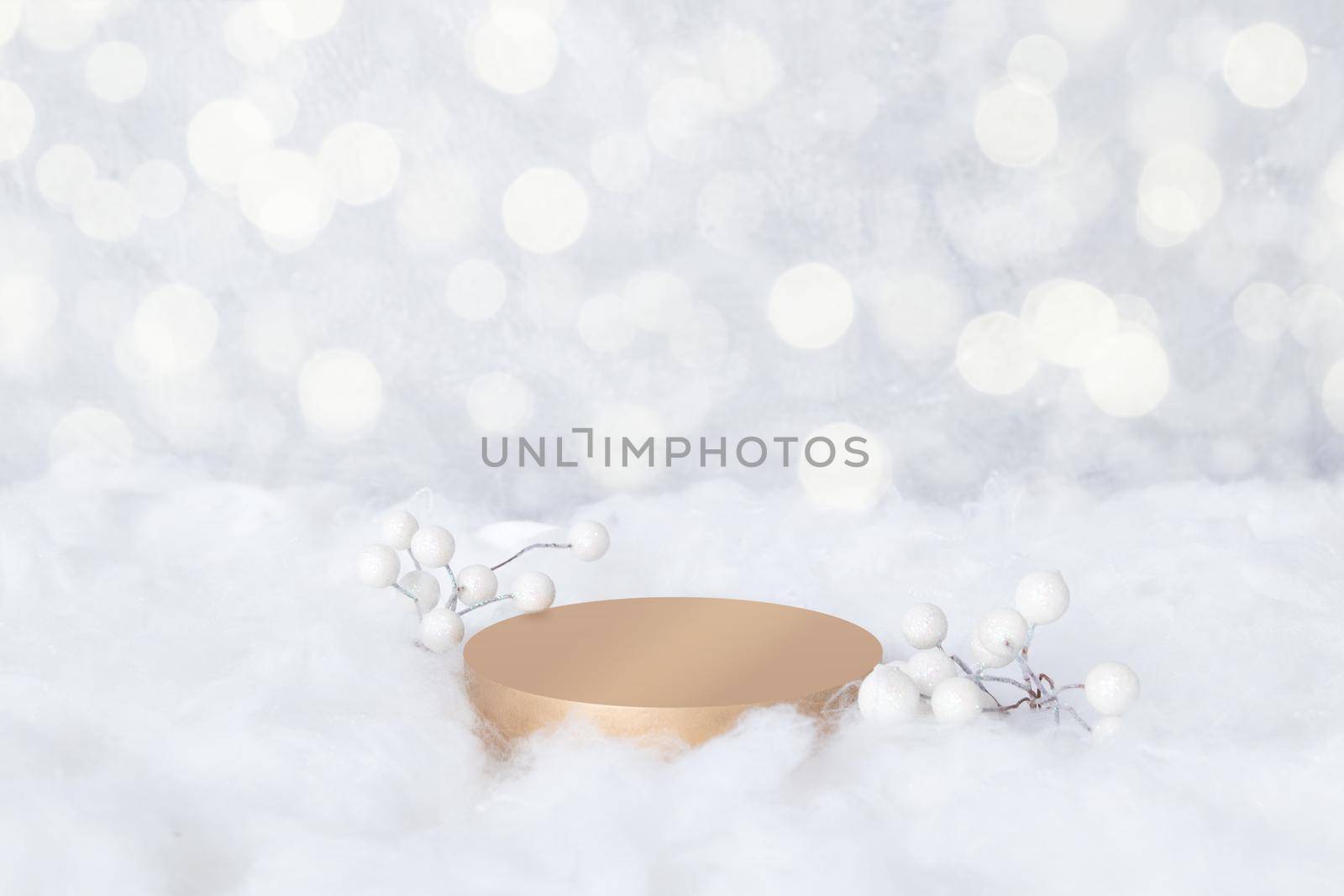 Podium mock-up for cosmetics in the snow with decorative berries on a bokeh background