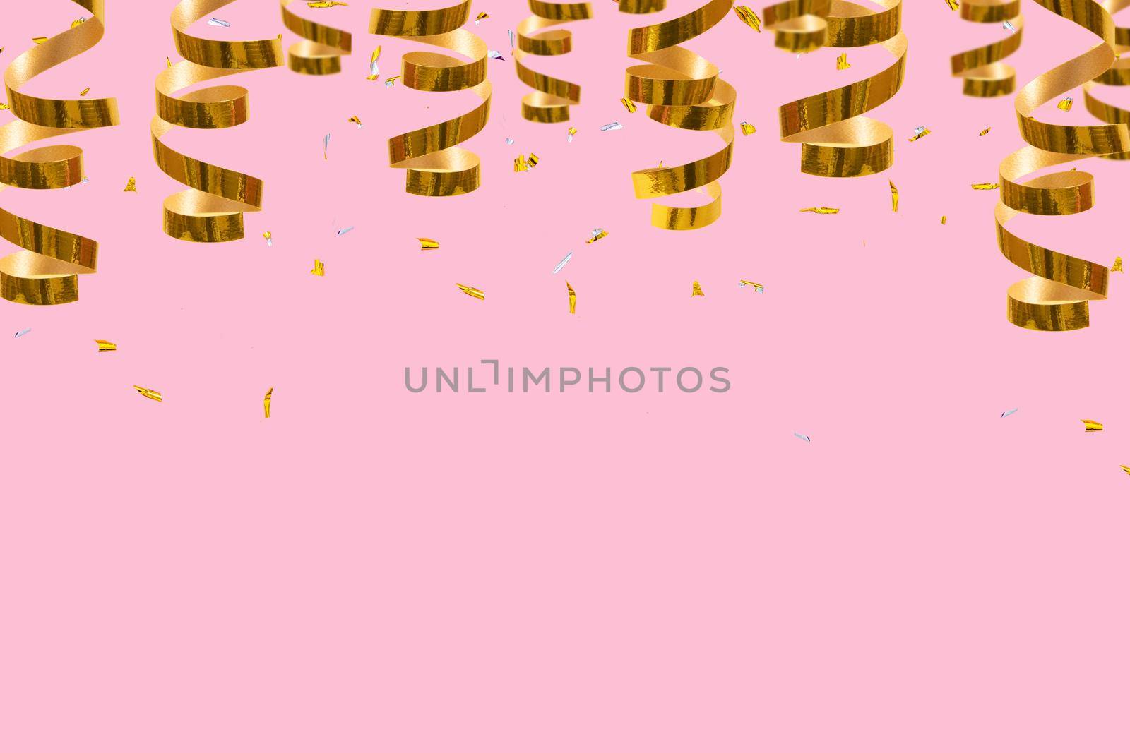 Golden spirals, streamers and confetti on a red background with place for text. Festive christmas background