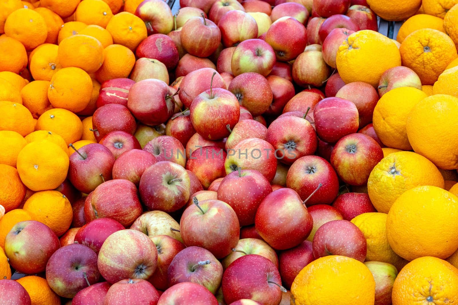 Apples and oranges for sale at a market