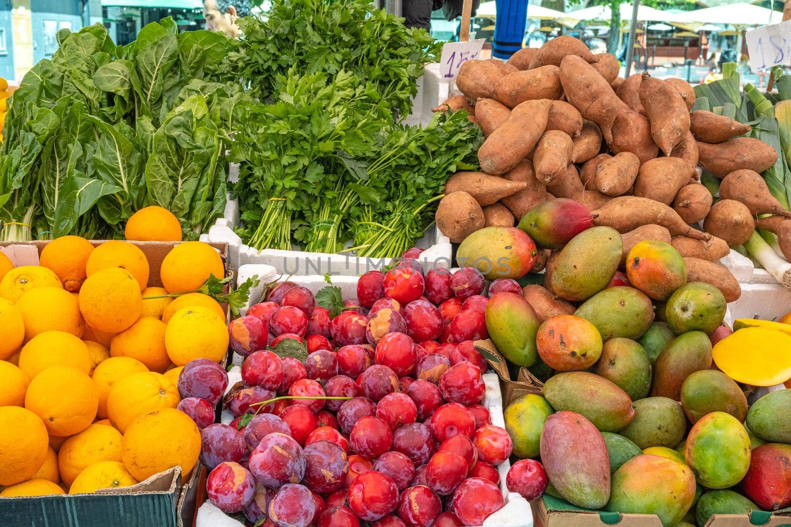 Fruits, vegetables and herbs for sale at a market