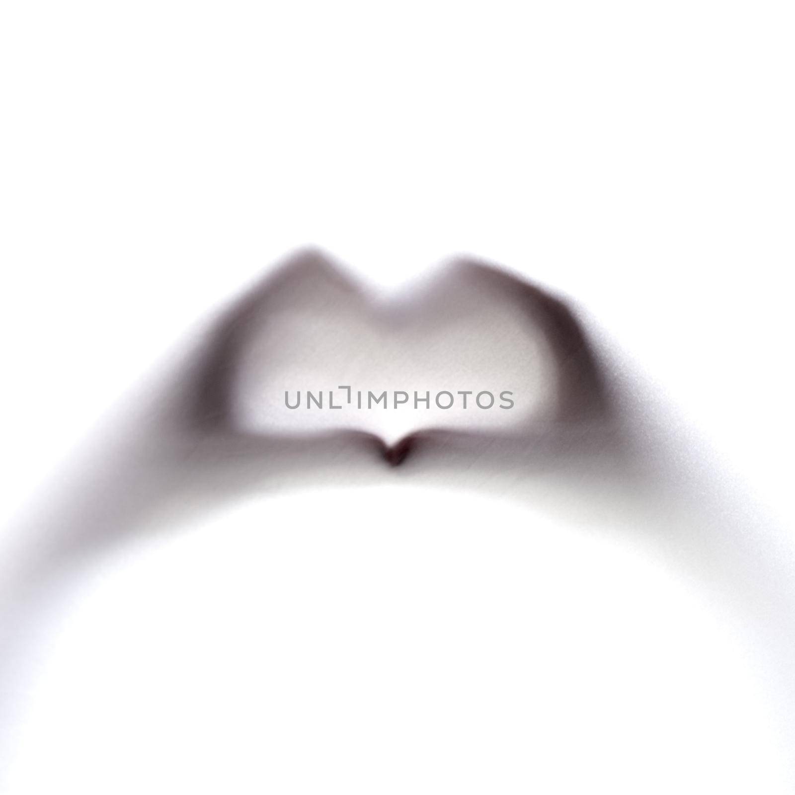 I heart you. an unrecognizable persons hands making a heart sign. by YuriArcurs