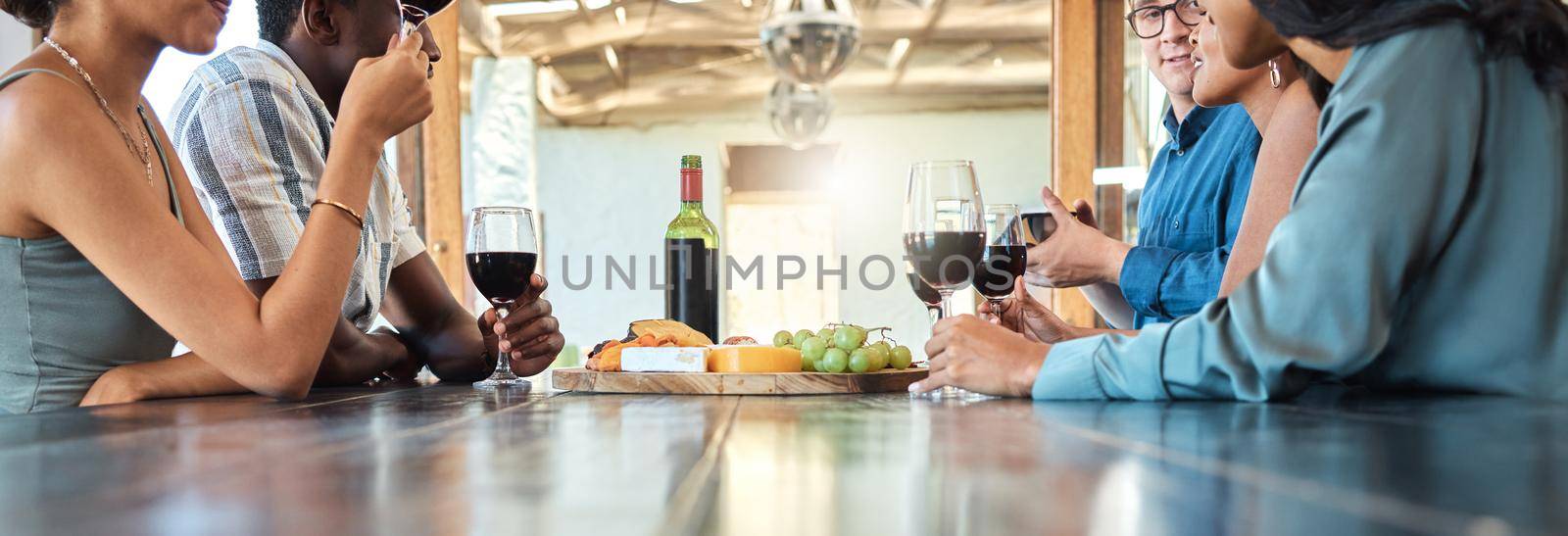Wine tasting and cheese platter with friends at a restaurant or estate in the winery in the agriculture or sustainability industry. Drinking alcohol with a group on a farm to drink or taste by YuriArcurs