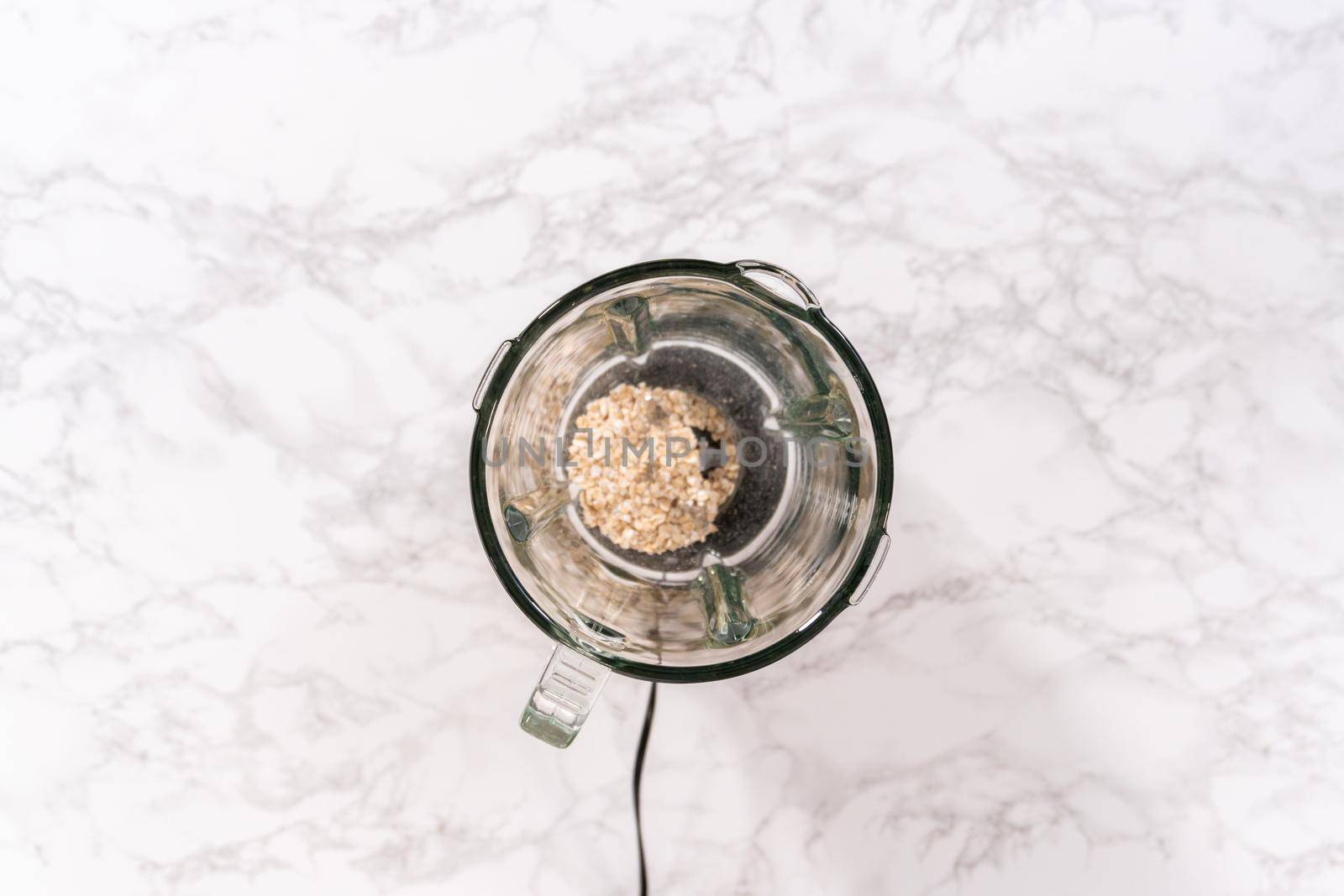 Flat lay. Blending ingredients for healthy breakfast strawberry banana smoothie in a kitchen blender.