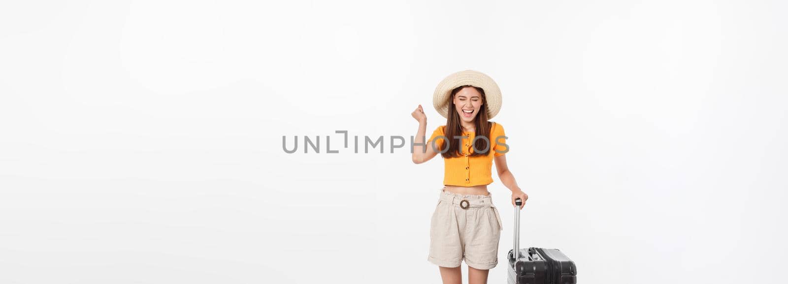 Woman tourist. Full length happy young woman standing with suitcase with exciting gesturing, isolated on white background. by Benzoix