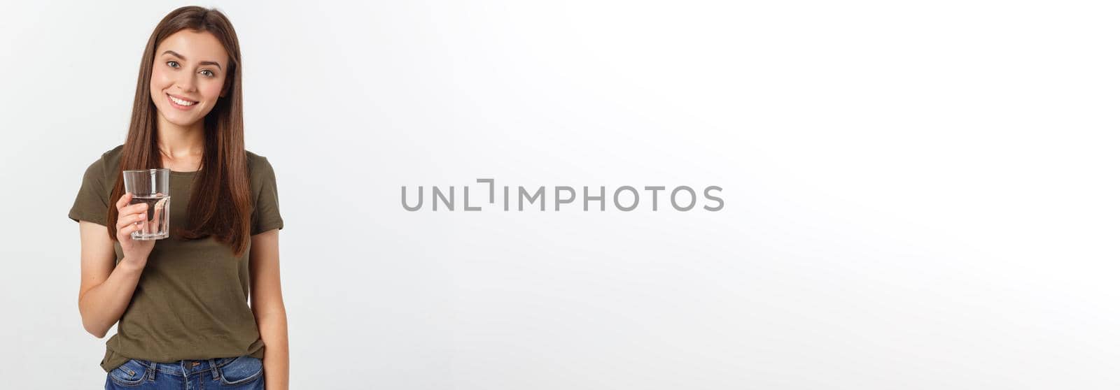 portrait of attractive caucasian smiling woman isolated on white studio shot drinking water