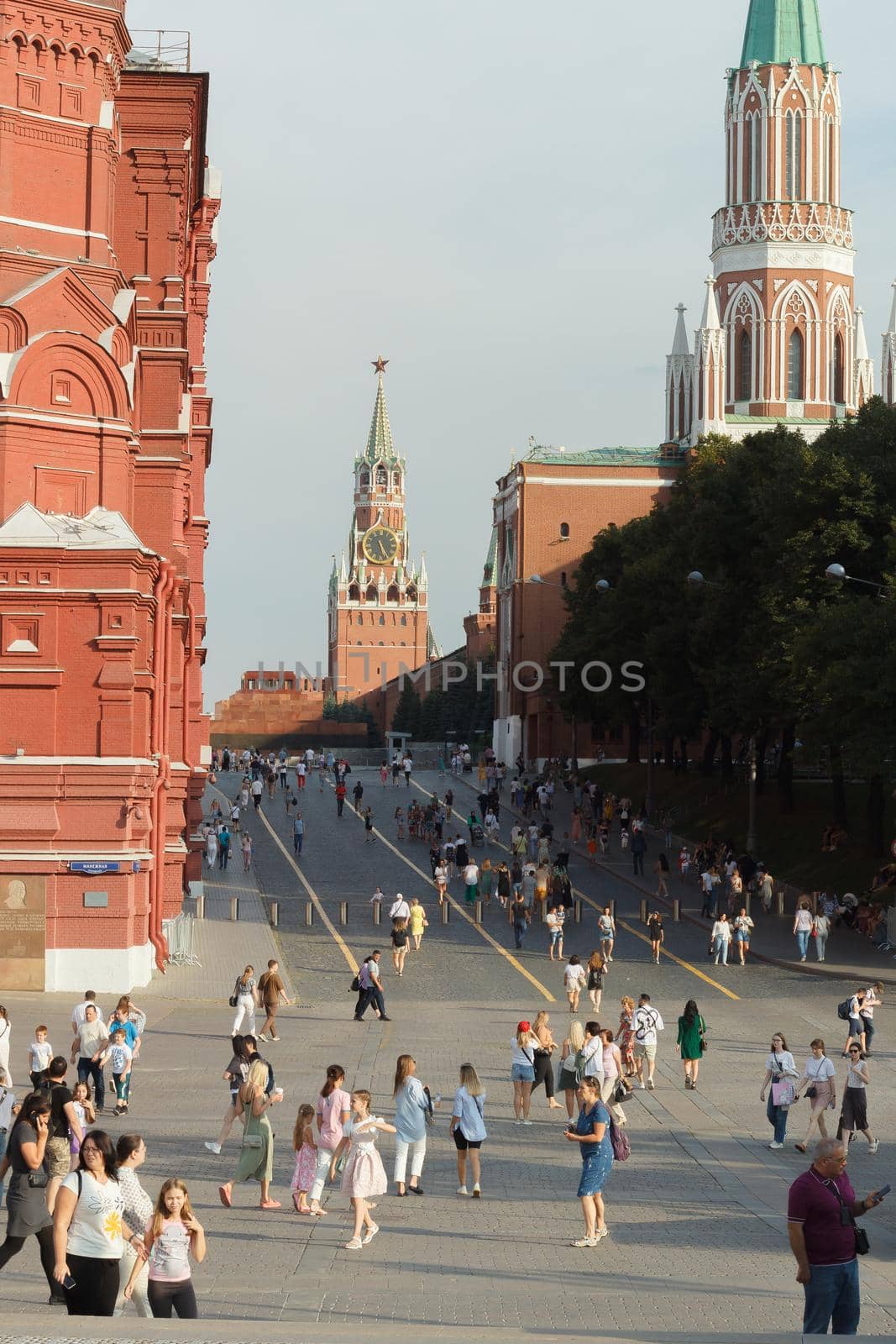 Moscow, Russia, 08.14.2022: People walk along the street decorated with floral decorations.