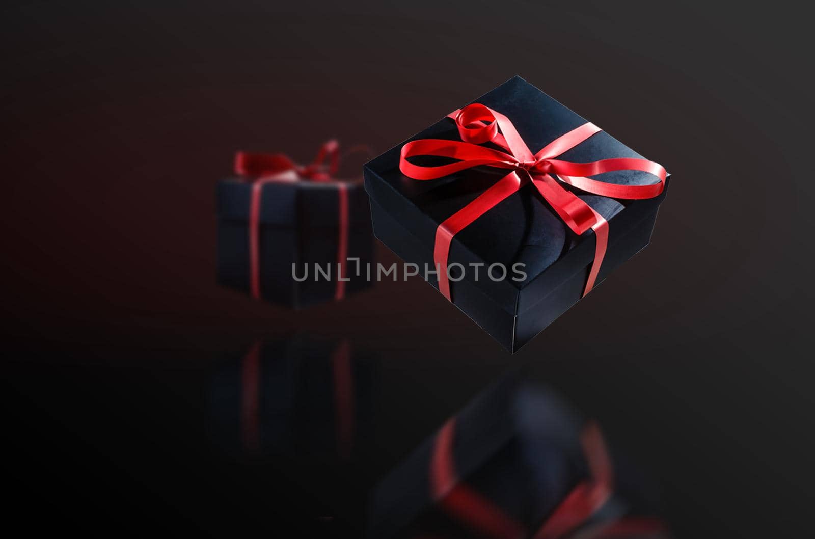 A pile various size black boxed gifts placed on stack. Christmas concept.