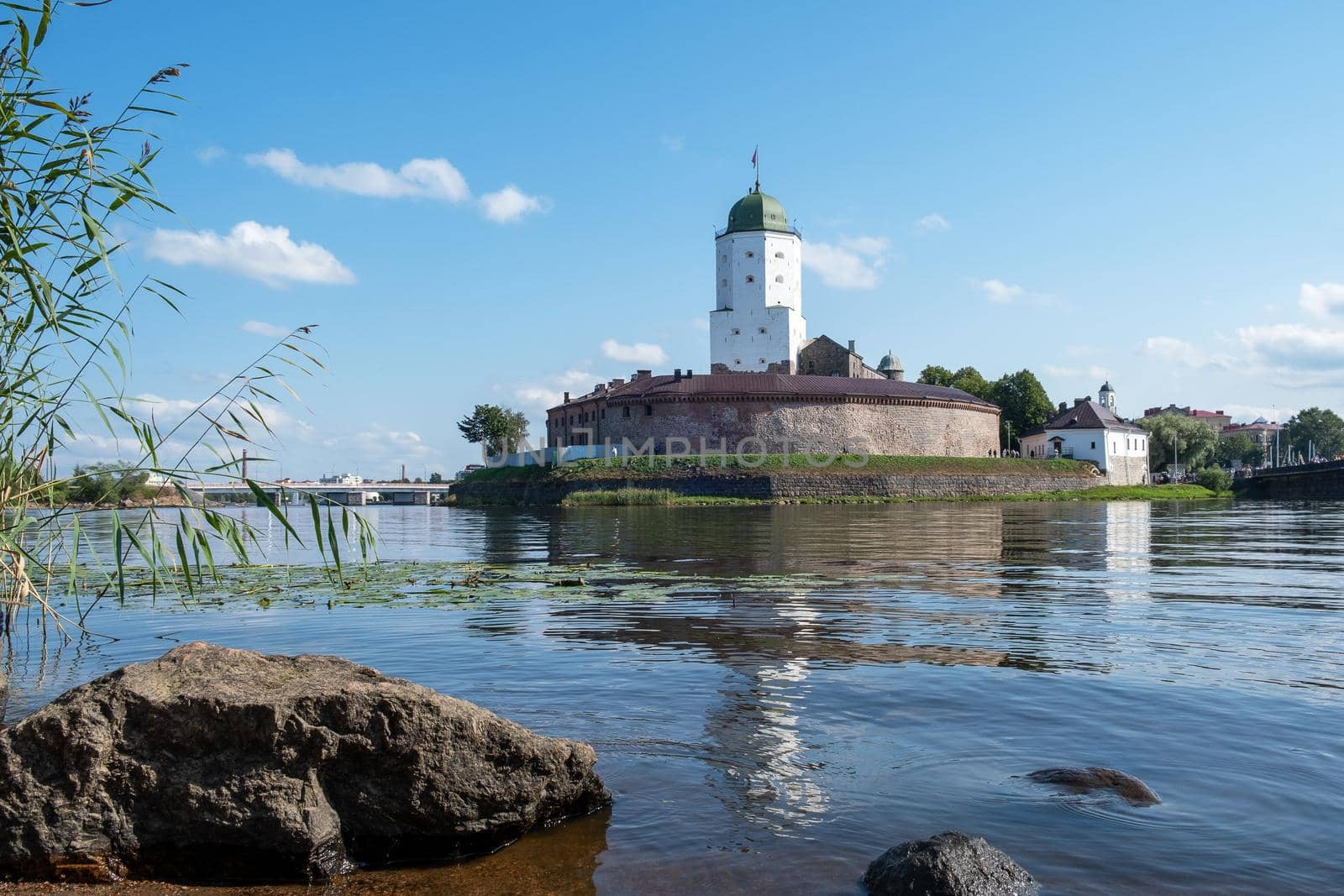 Vyborg, Leningrad region, Russia. - August 27, 2022. View of the medieval knight's castle from the city embankment. Selective focus.