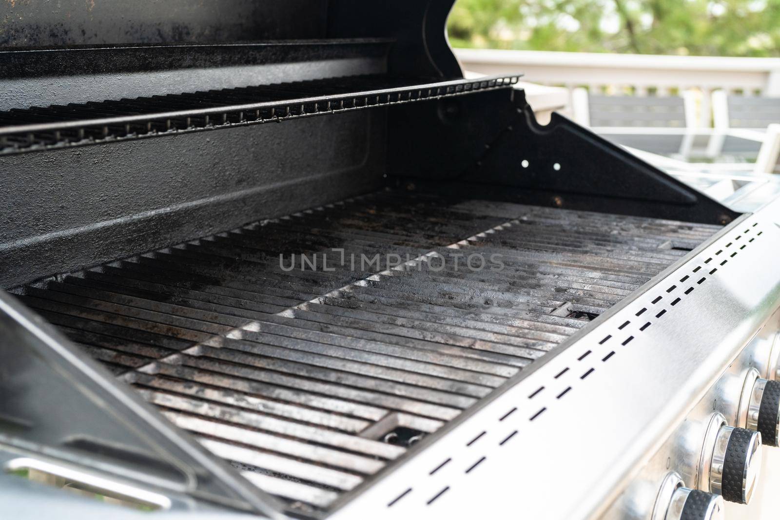 Clean six-burner gas grill ready for summer grilling.