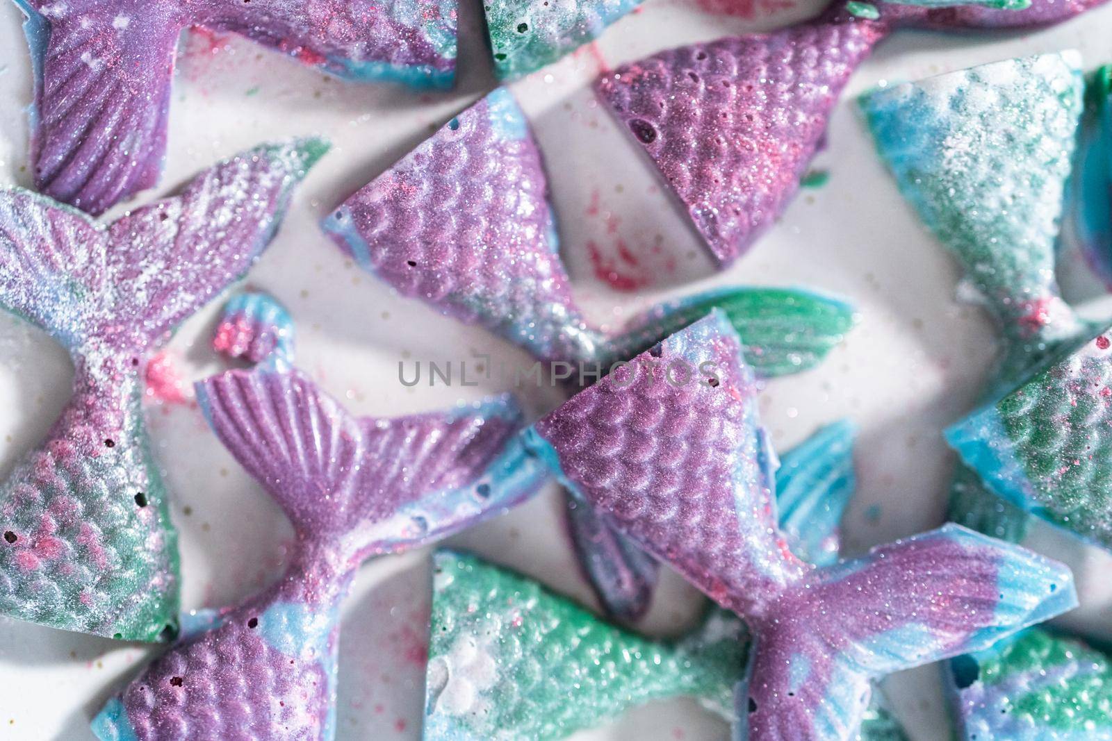 Homemade chocolate mermaid tails covered with glitter dust.