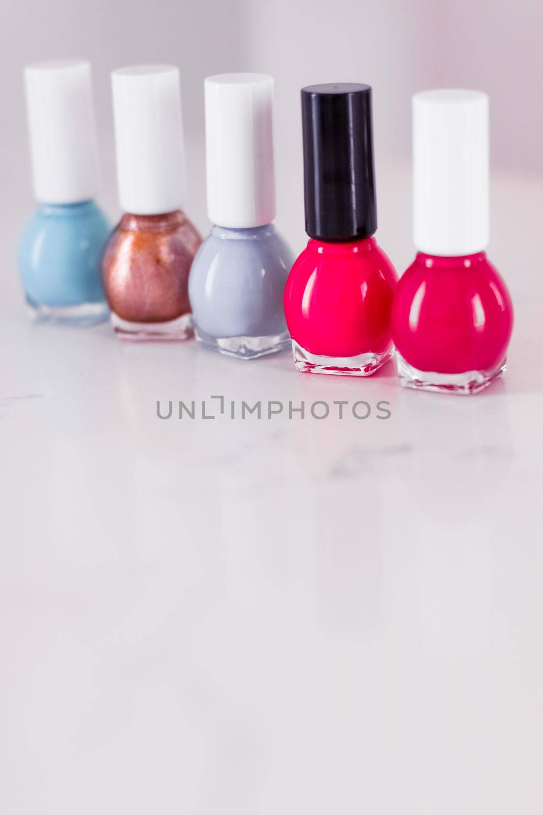 Beauty, make-up and cosmetics concept - Nail polish bottles, manicure and pedicure collection