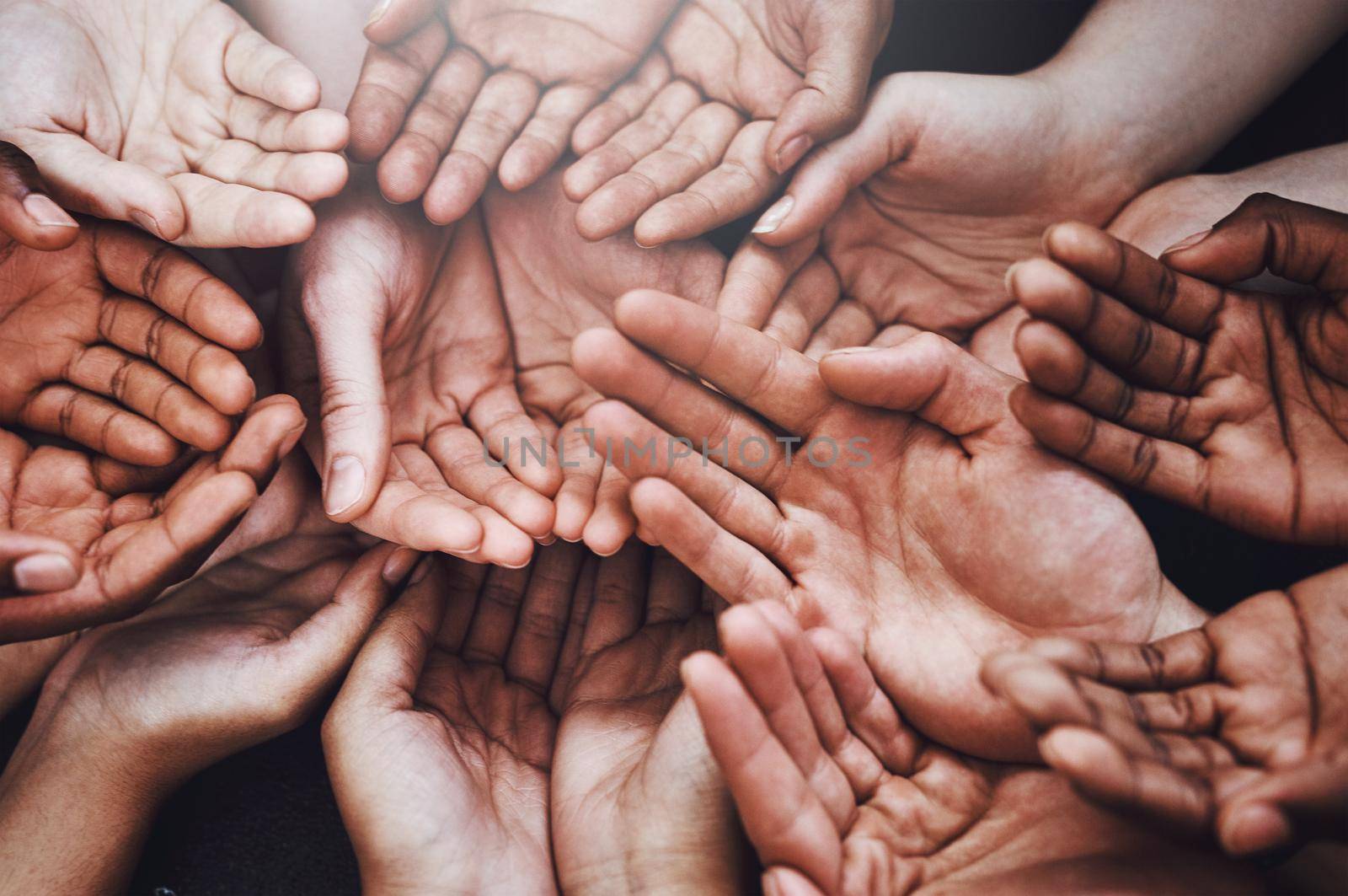 Open your heart to the open hands. a group of hands held cupped out together. by YuriArcurs