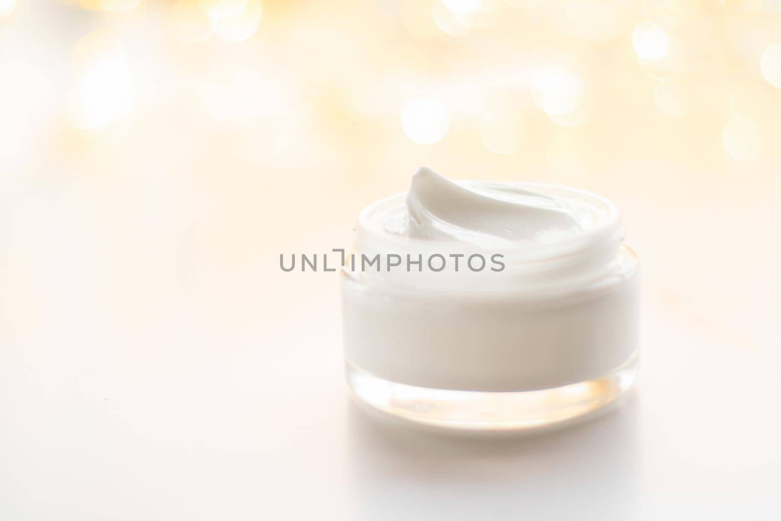 Beauty, anti-age cosmetics and skincare concept - Luxury face cream jar and holiday glitter