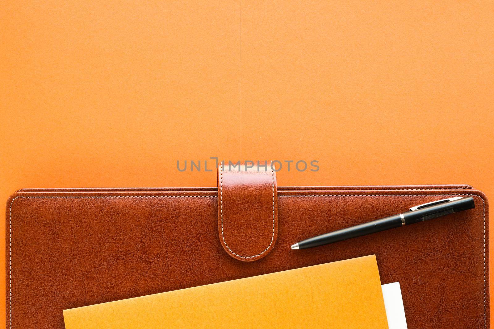 Luxury business brown brief-case on the office table desk, flatlay by Anneleven