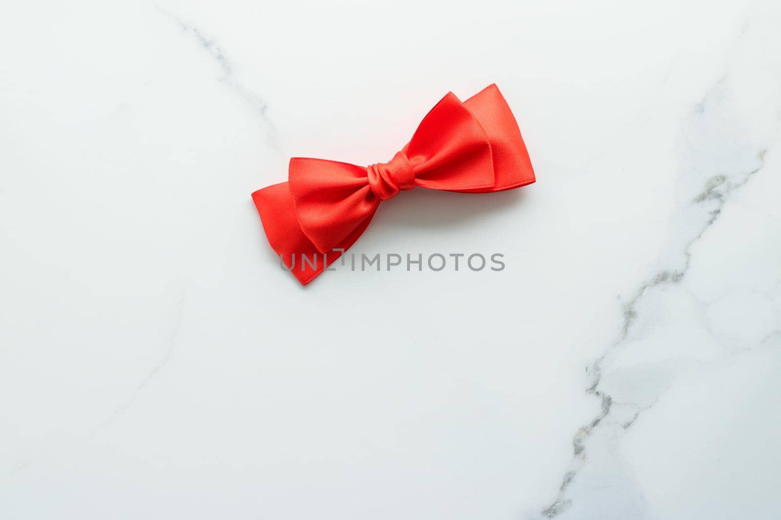 Holiday decor, feminine design and flatlay concept - Red silk ribbon on marble, top view