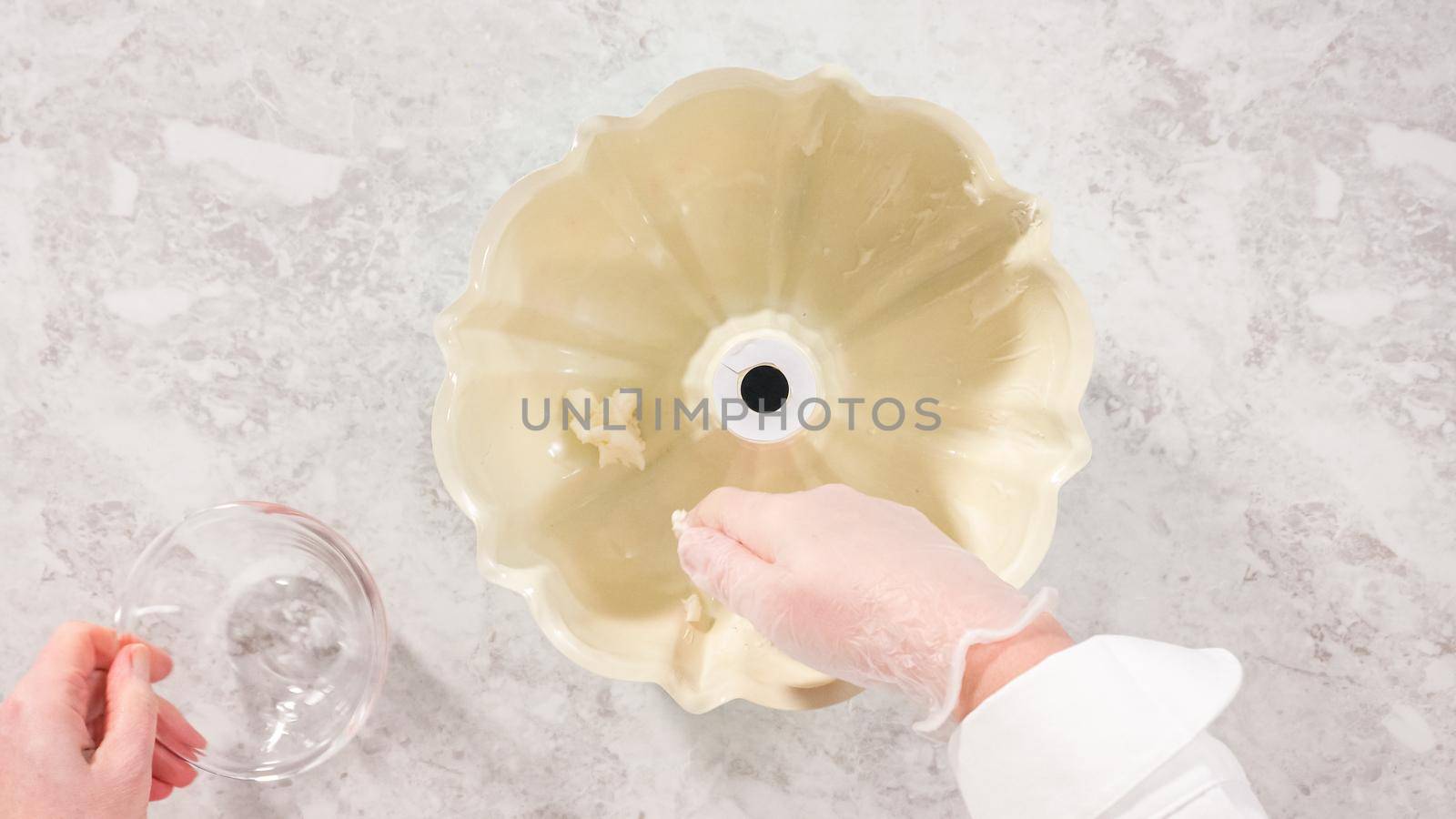 Flat lay. Step by step. Greasing bundt cake pan with vegetable shortening and flour to bake funfettti bundt cake.