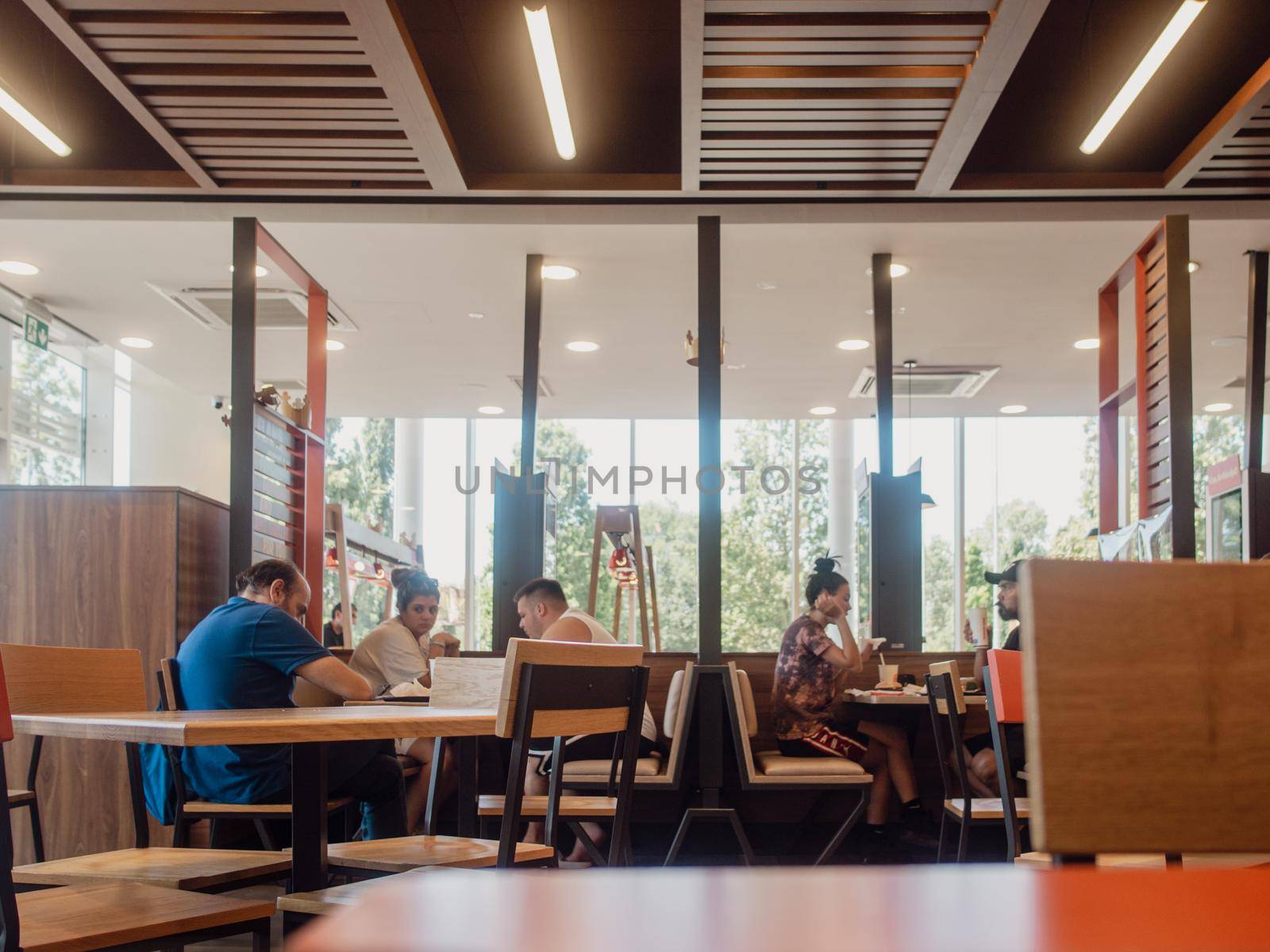 woman orders meal in the electronic touch screen terminal menu in the fastfood restaurant Burger King