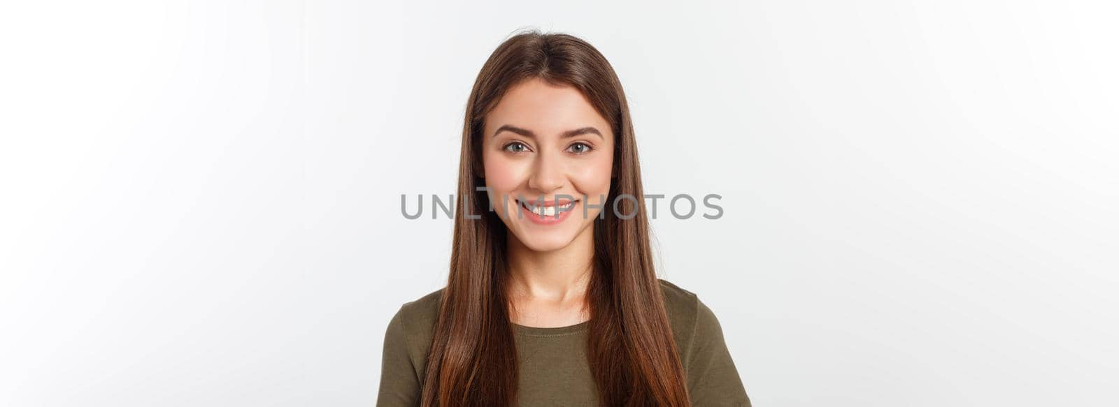 Close-up portrait of yong woman casual portrait in positive view, big smile, beautiful model posing in studio over white background. by Benzoix