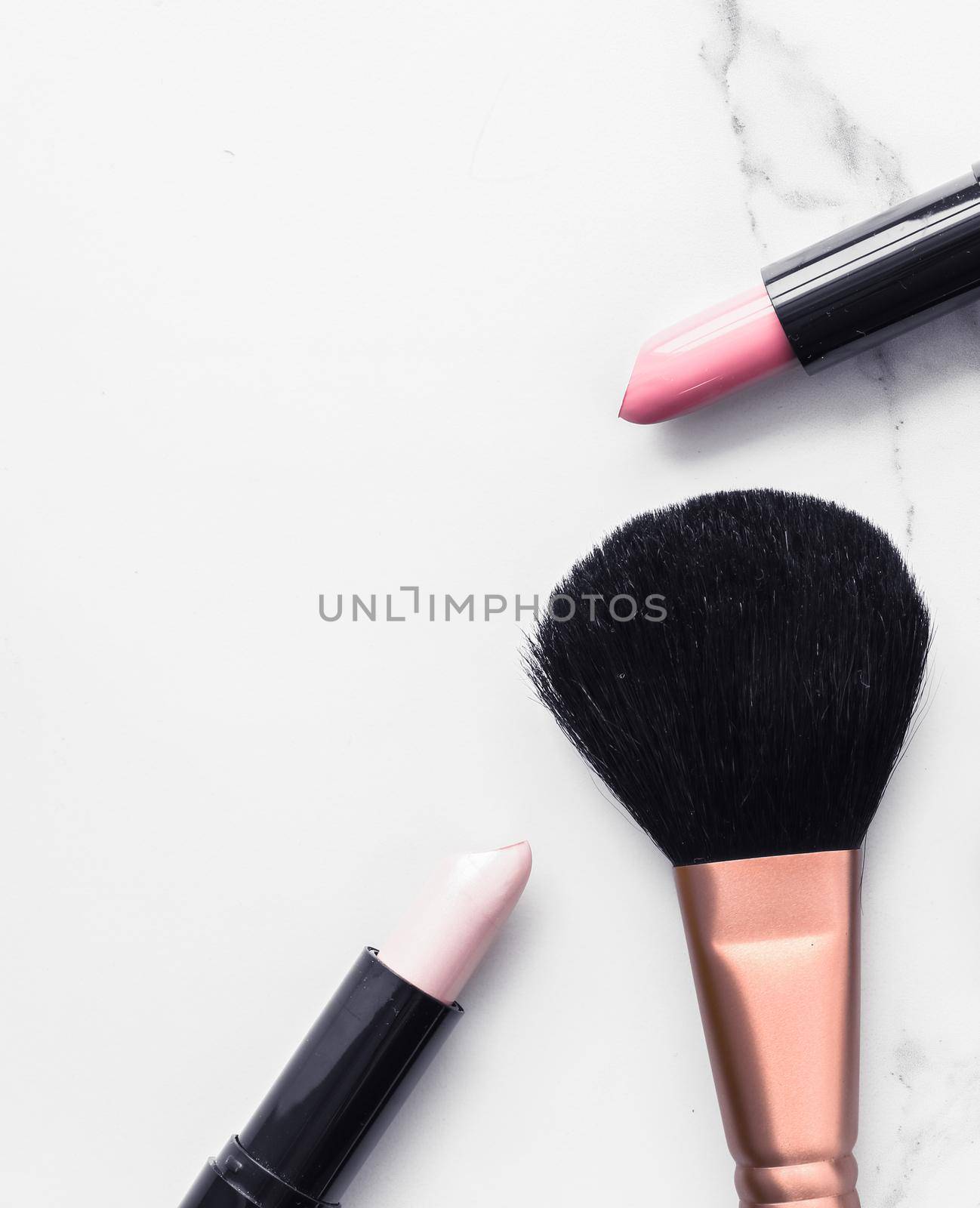 Make-up and cosmetics flatlay on marble by Anneleven