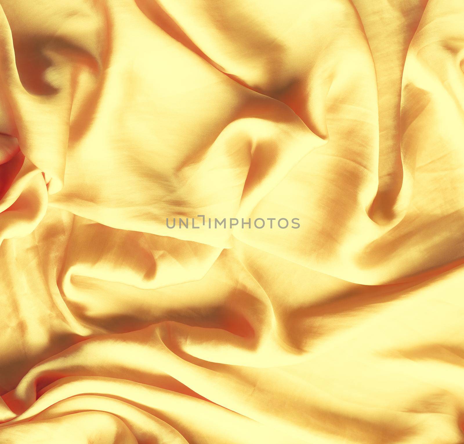 Luxury golden silk background texture - elegant fabric textures, abstract backgrounds and modern pastel colours concept