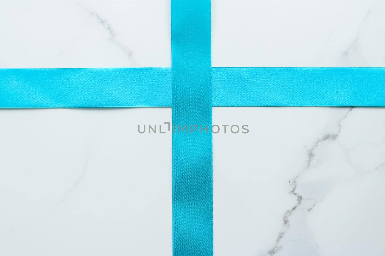 Holiday decor, feminine design and flatlay concept - Blue silk ribbon on marble, top view