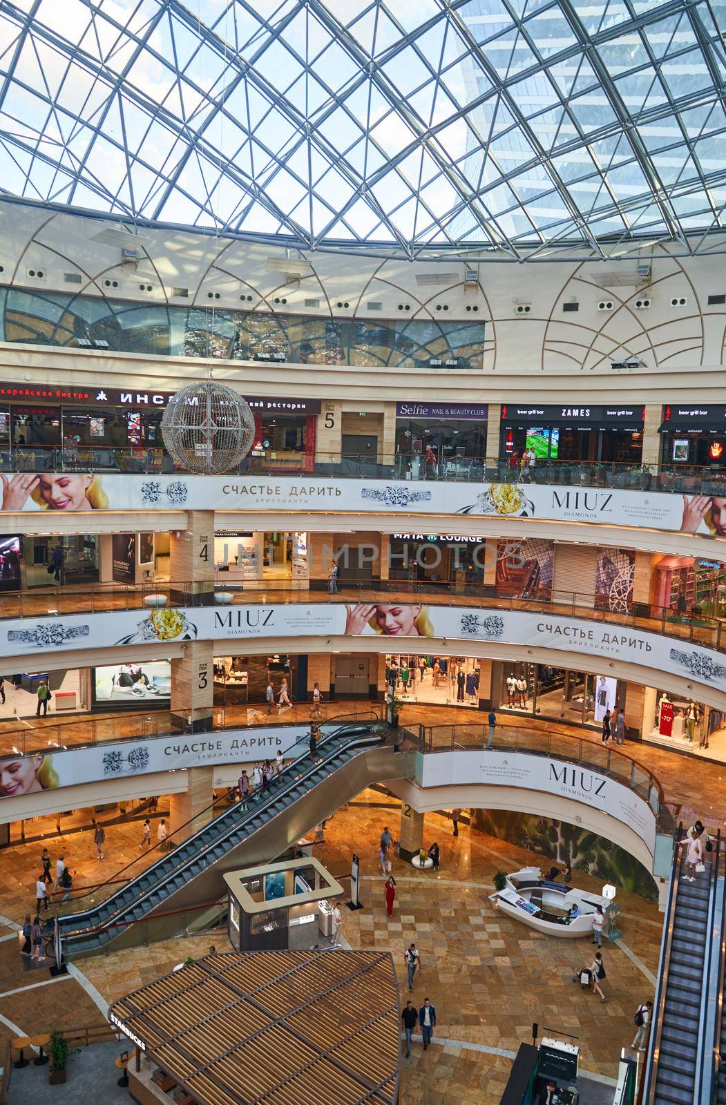 Moscow, Russia - 30.07.2022: View of the floors of the Afimall shopping center in Moscow, Russia. Clothing stores, restaurants in mall. High quality photo