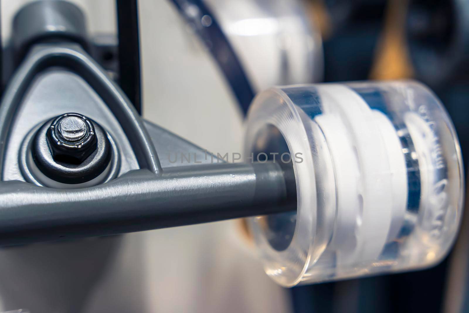 a skateboard wheel and axle. Skateboard, wheels, axle in a sports store on display. new and shiny skateboard wheels. Skateboard details close - up . extreme sports