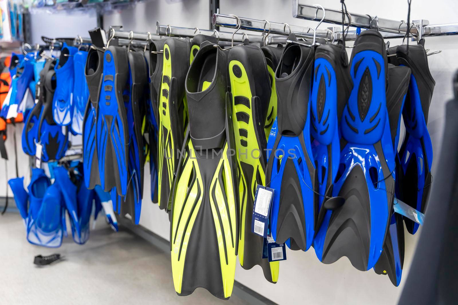 new fins for swimming on sale in a sports store. Active recreation by audiznam2609