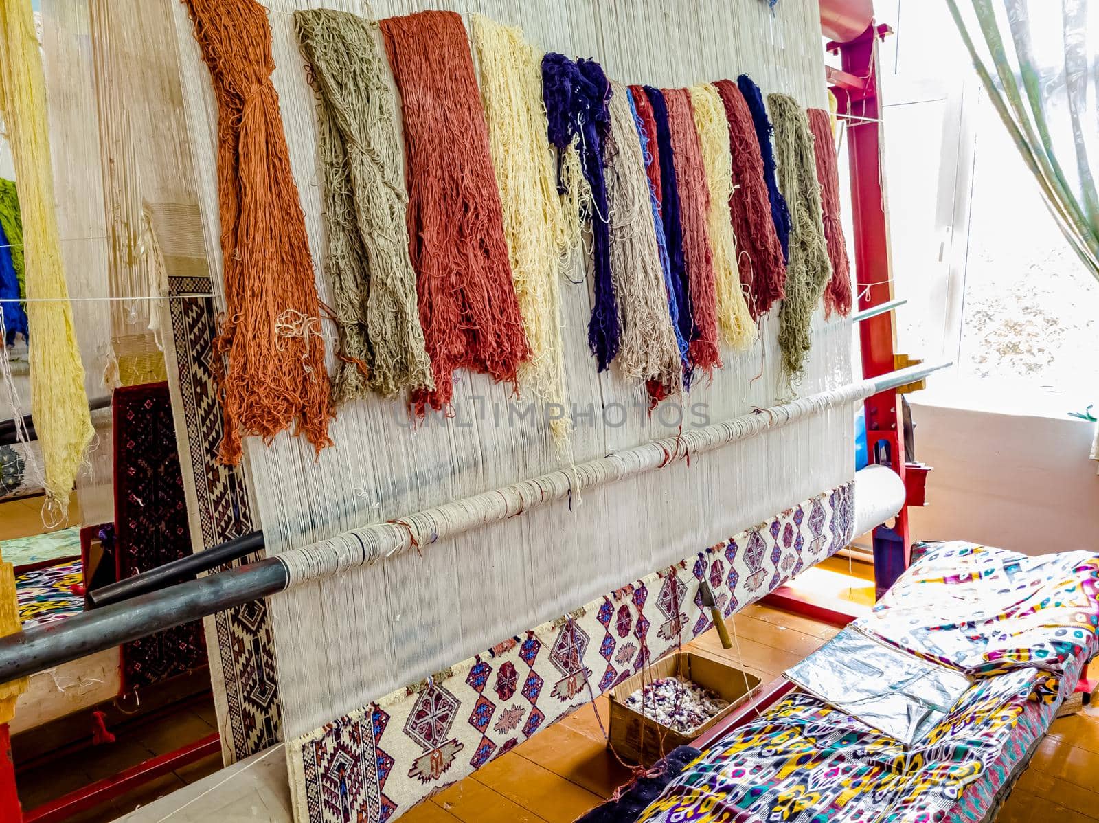 Workshop for the manual production of silk carpets in Central Asia. Uzbekistan by Milanchikov