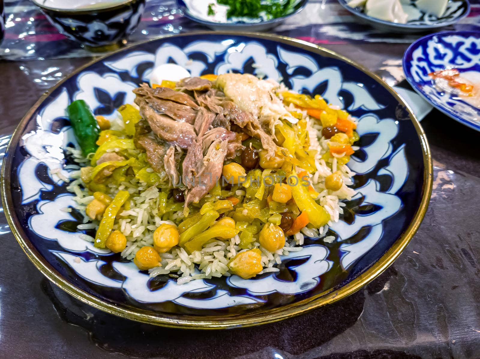 Traditional Uzbek pilaf from Samarkand. Meat, vegetables and rice are not mixed and laid out in layers by Milanchikov