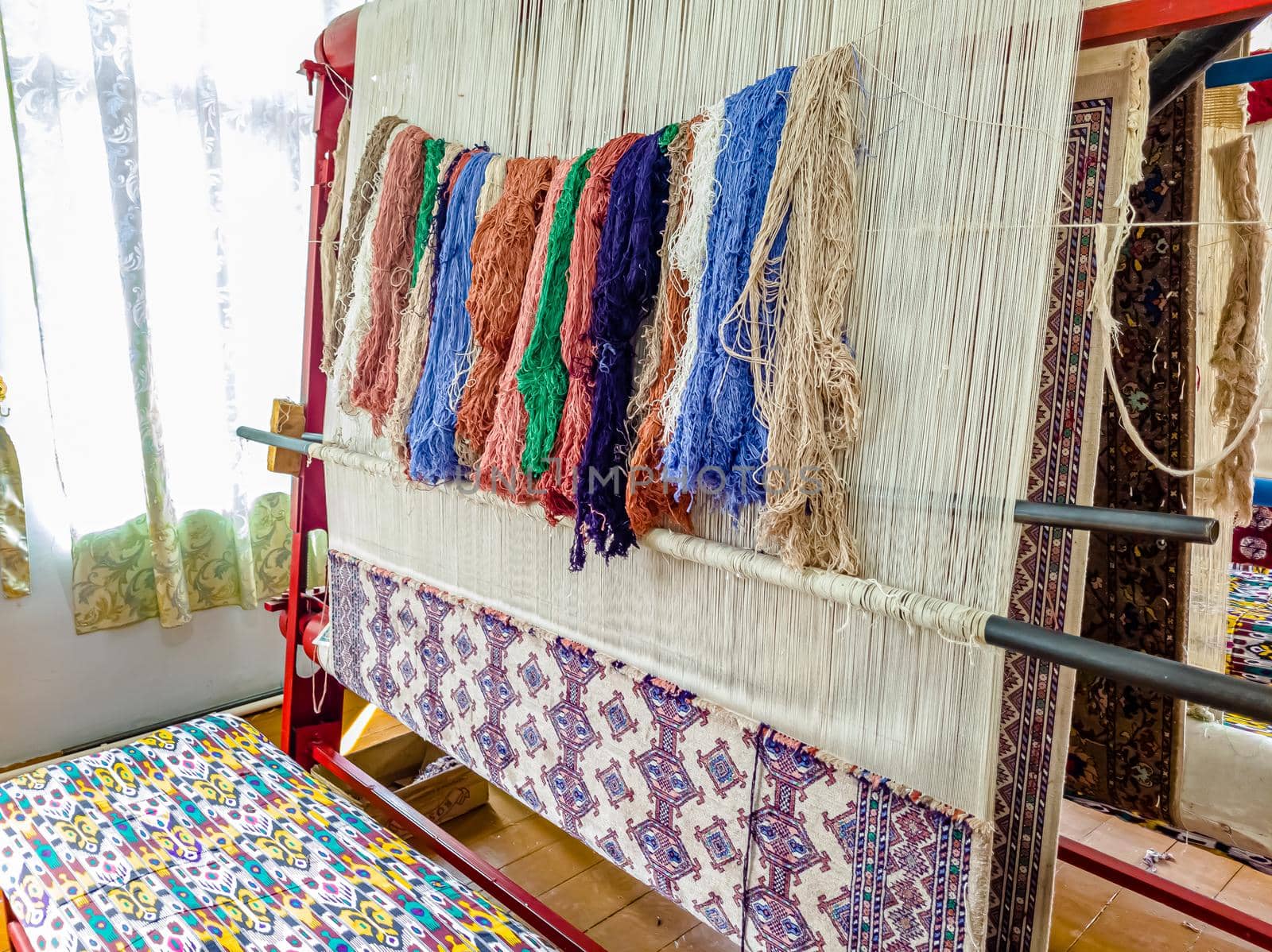 Workshop for the manual production of silk carpets in Central Asia. Uzbekistan.