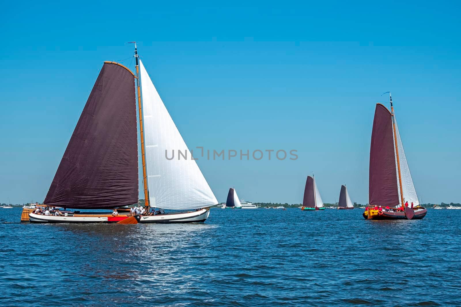 Traditional Frisian wooden sailing ships in a yearly competition by devy