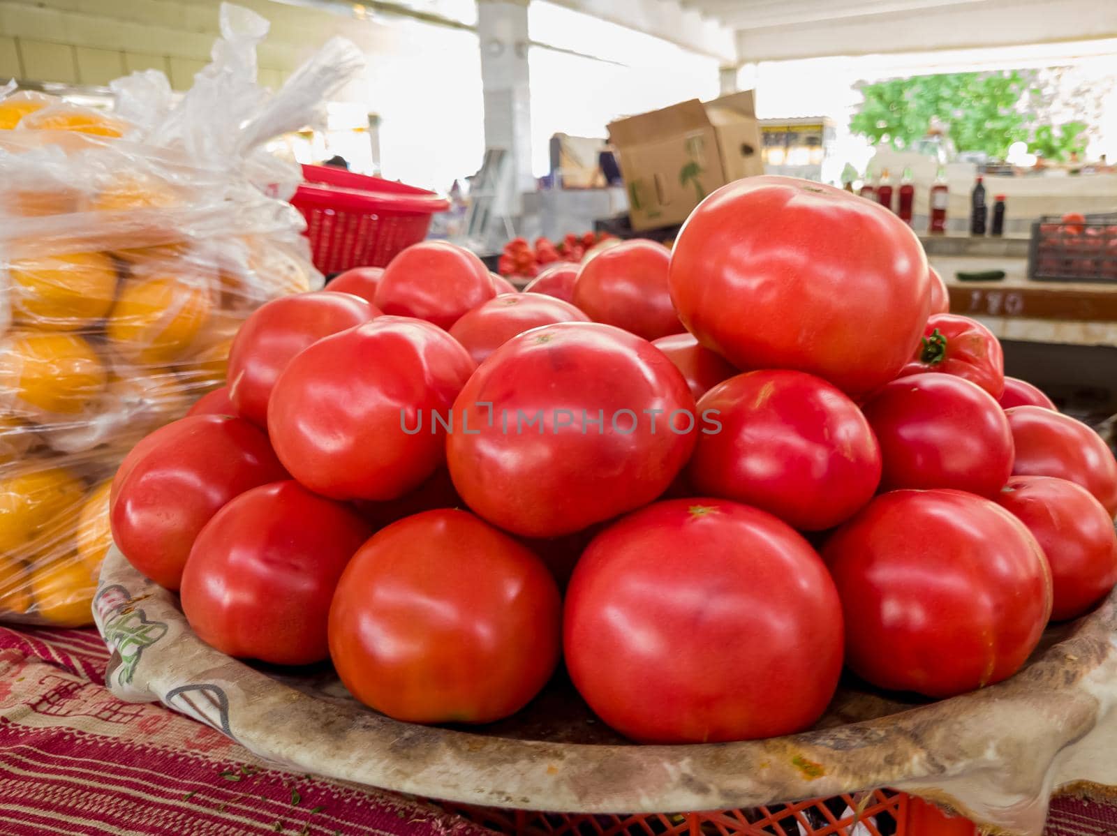 Street market with vegetables and fruits. Shopping for a bazaar. Counter with tomatoes
